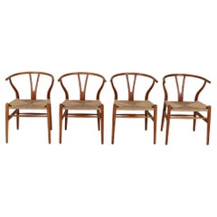 CH24 Wishbone Chairs in vintage oak by Hans J Wegner - Set of 4