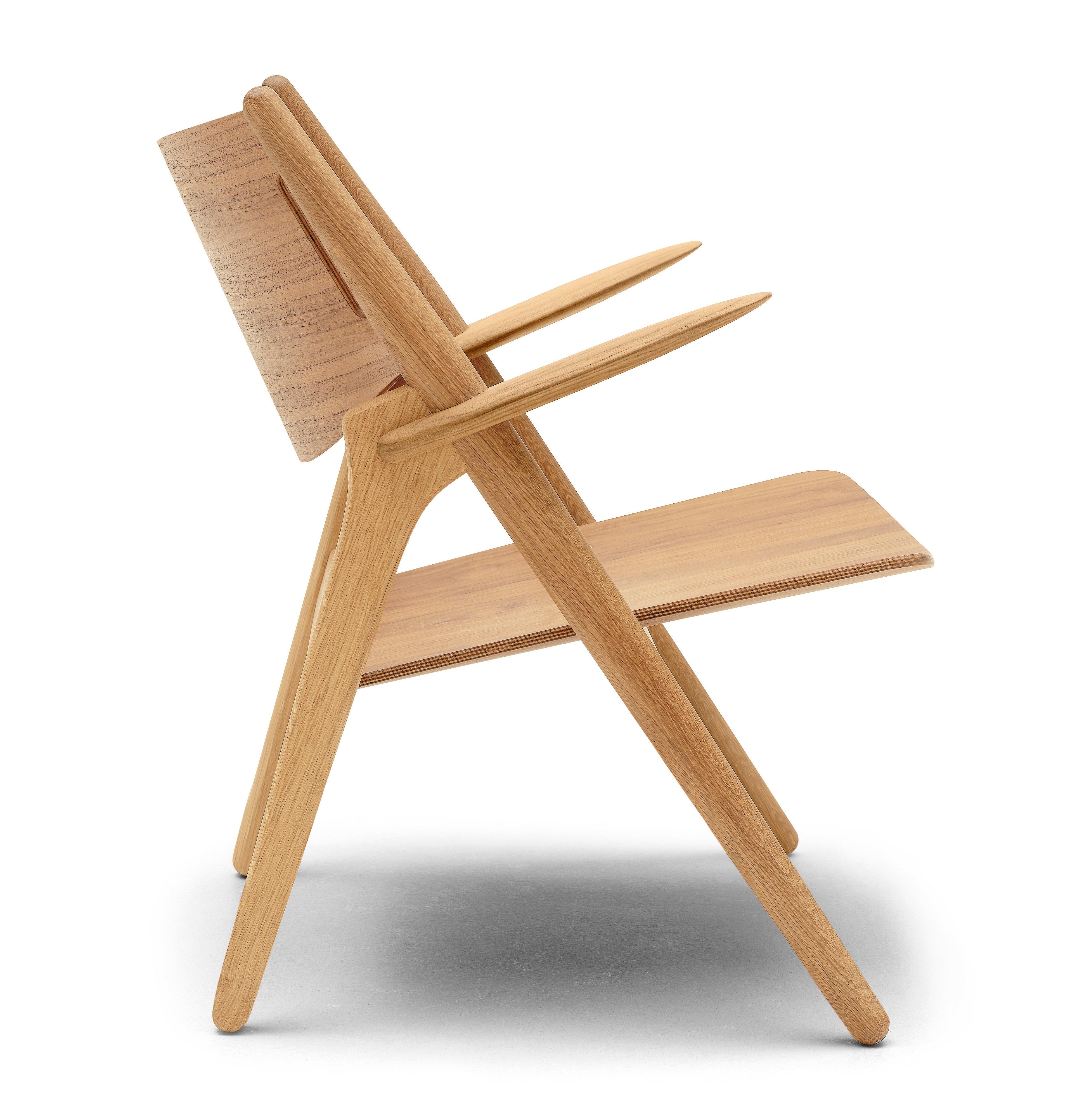 The CH28T lounge chair by Hans J. Wegner is very precise in its expression. It showcases Wegnerâ€™s dedication to finding the optimal balance of function and visually attractive form. Wegner attained an intriguing dynamic between the slender,