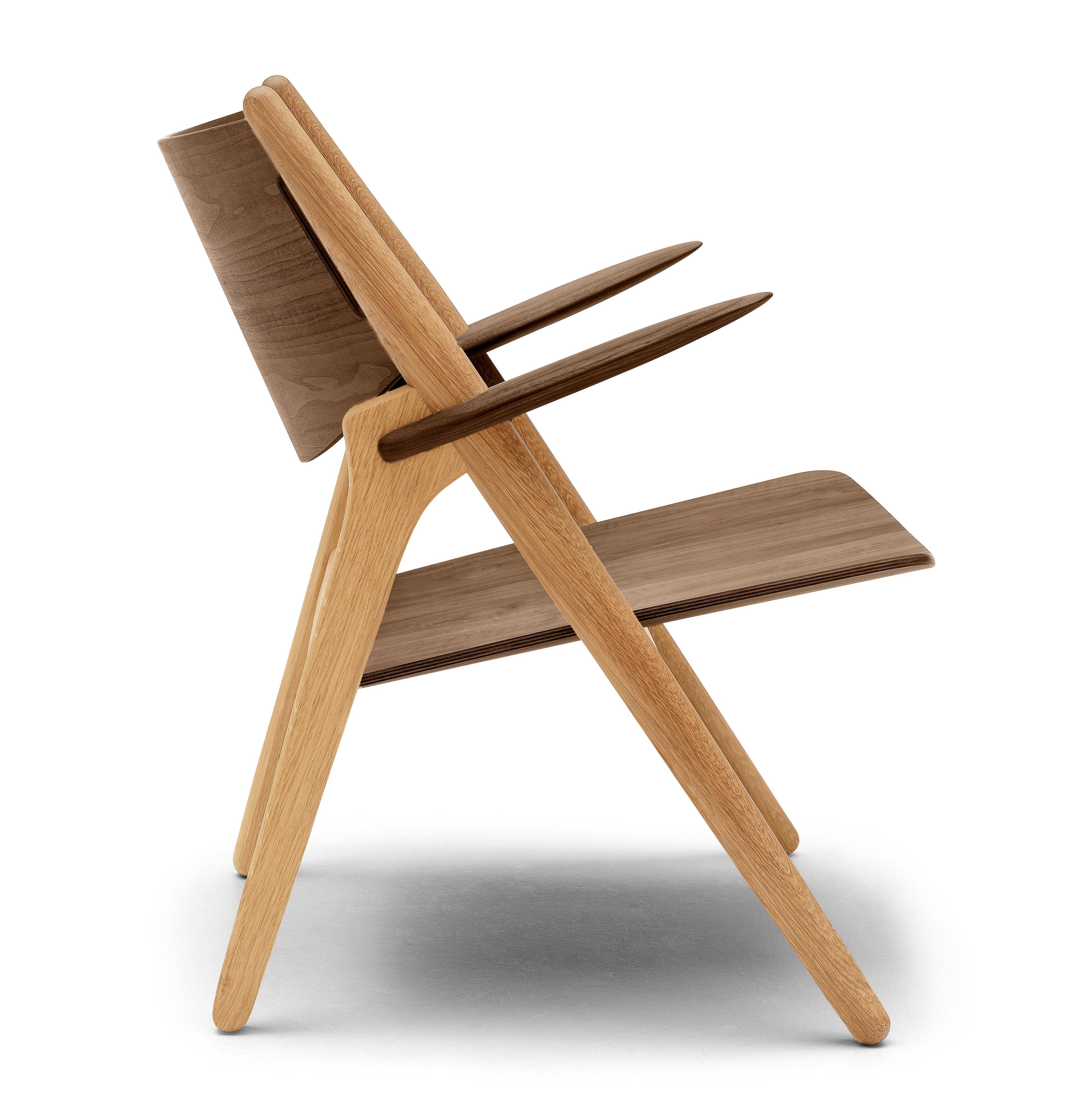 The CH28T lounge chair by Hans J. Wegner is very precise in its expression. It showcases Wegnerâ€™s dedication to finding the optimal balance of function and visually attractive form. Wegner attained an intriguing dynamic between the slender,