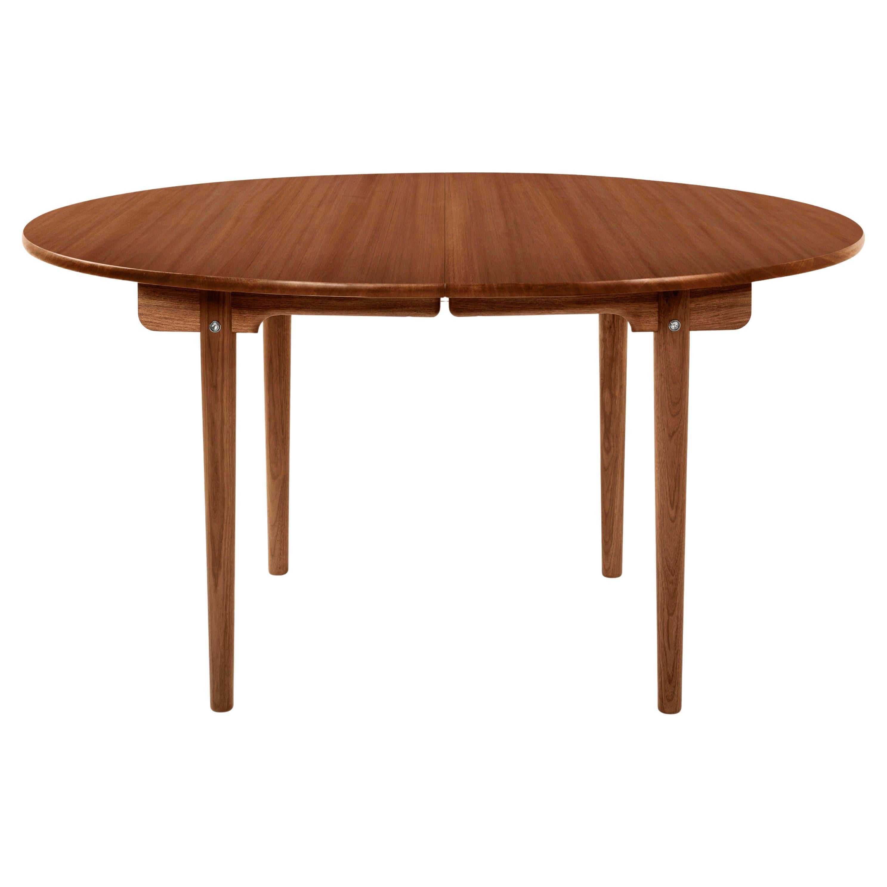 This table is offered in Beech, Oak, Walnut and Mahogany in a variety of wood treatments (Soap, Lacquer, Oil, White Oil, Smoked Oil).  This table can be prepared to accept 2 leaves. Pricing will vary depending on the material and finish. Priced as