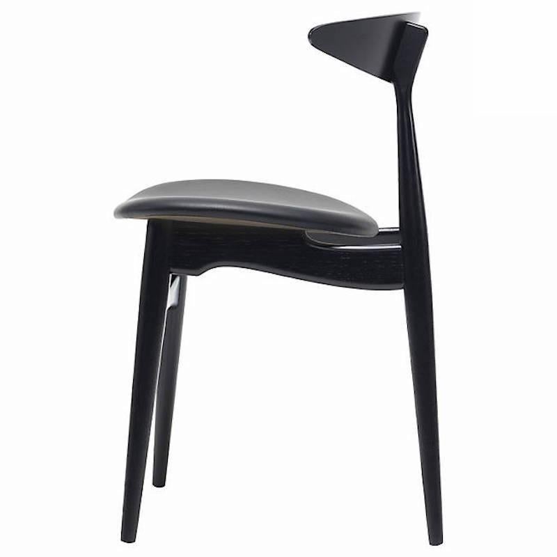CH33P dining chair in black by Hans J. Wegner for Carl Hansen & Son. Black lacquered oak with black leather seat. 

CH33P chair
by Hans J. Wegner
The superior comfort and expert design of the CH33P chair keep this classic Hans J. Wegner design
