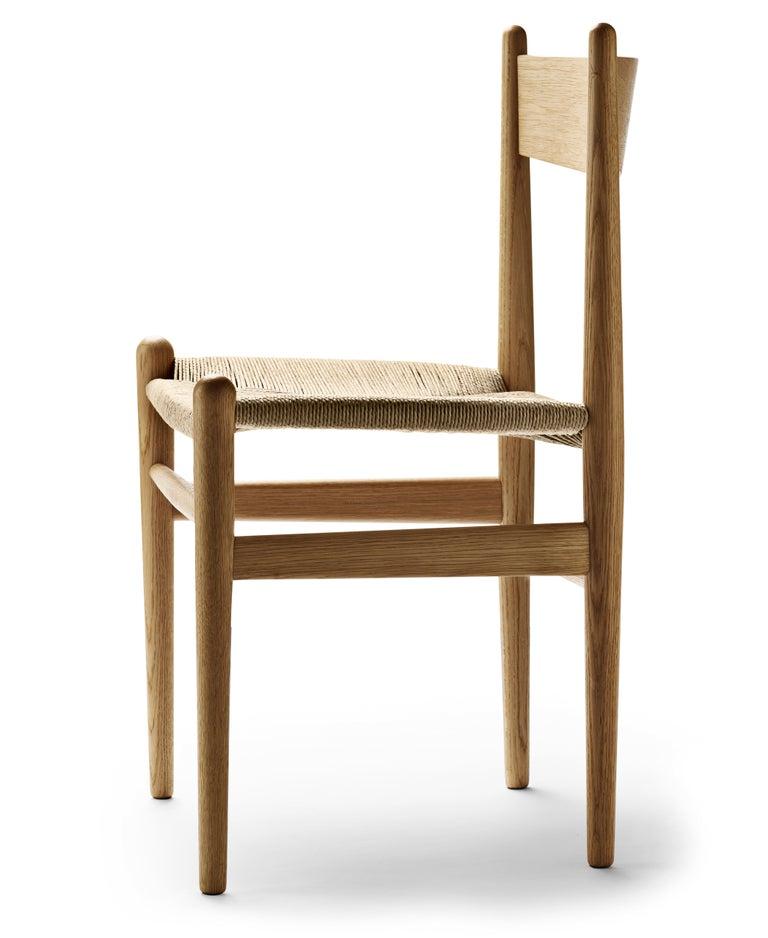 The CH36 dining chair by Hans J. Wegner is crafted with great attention to each detail in a simple and functional design. This 1962 design demonstrates the influence American Shaker furniture principles and craftsmanship had on Wegnerâ€™s work. The