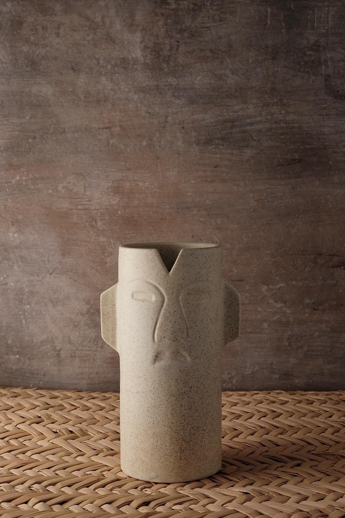 Chac ceramic vase by Onora
Dimensions: D 12 x 25 cm
Materials: Ceramic
Available in black, white and sand.

This ceramic vase refers pre-hispanic ceremonial masks. Molded by artisans from the State of Mexico.

This collection reinterprets one