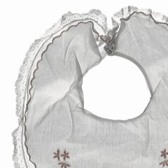 Aliboo Bib: Still Life Photograph of White & Pink Child's Embroidered Clothing