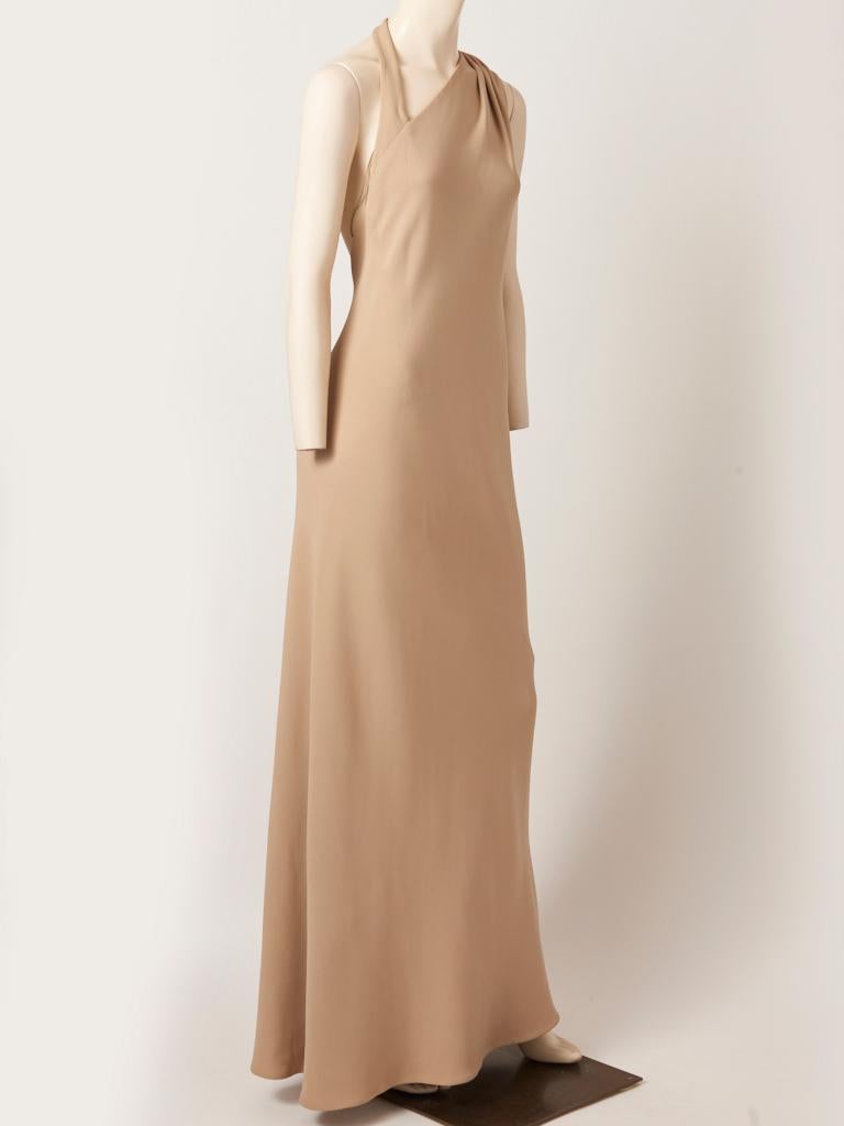 Chado Ralph Rucci, bias cut , one shoulder evening gown, in a beige silk crepe, having a gathered, bias cut back panel coming from the shoulder. Dress has a back zipper closure and a asymmetric, neckline.