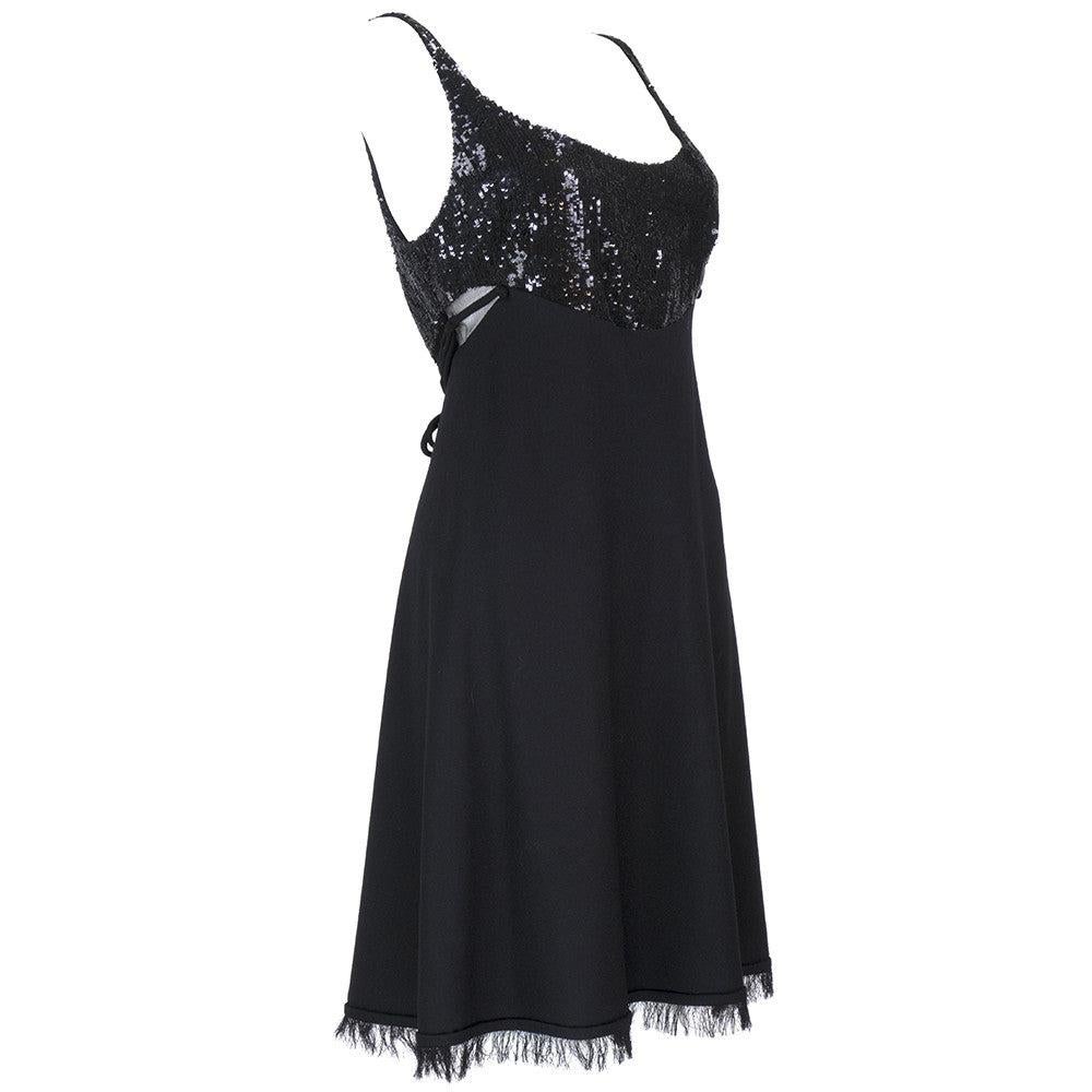 Sweet and sexy little mini dress by the master Ralph Rucci. 100% cashmere with micro sequins at bodice. Mesh cut-outs at side. On purpose frayed trim at hem. Luxurious and lined in satin. Excellent condition.  Couture craftsmanship.

Additional