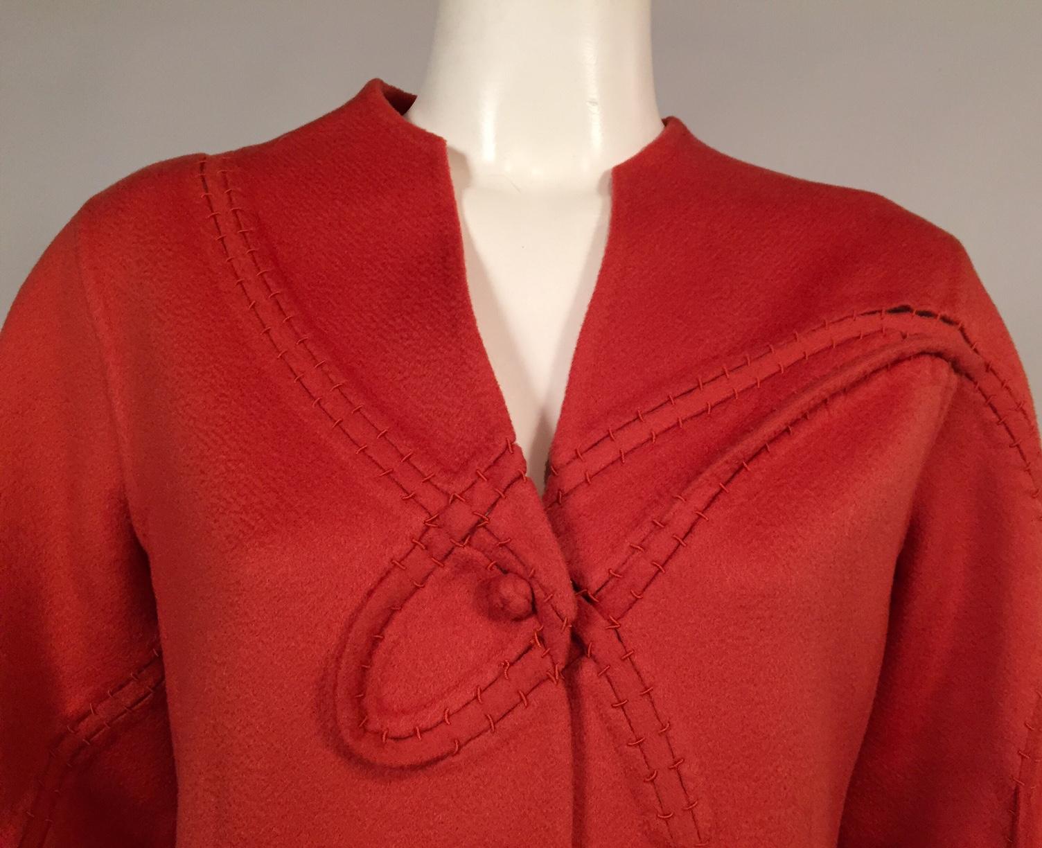 The detail and hand finishing on this jacket is just amazing. It is a double layer of cashmere with swirling open seams held together by rows of stitches. The cuffs and hem are finished with a triple braid of the same cashmere. The four buttons are