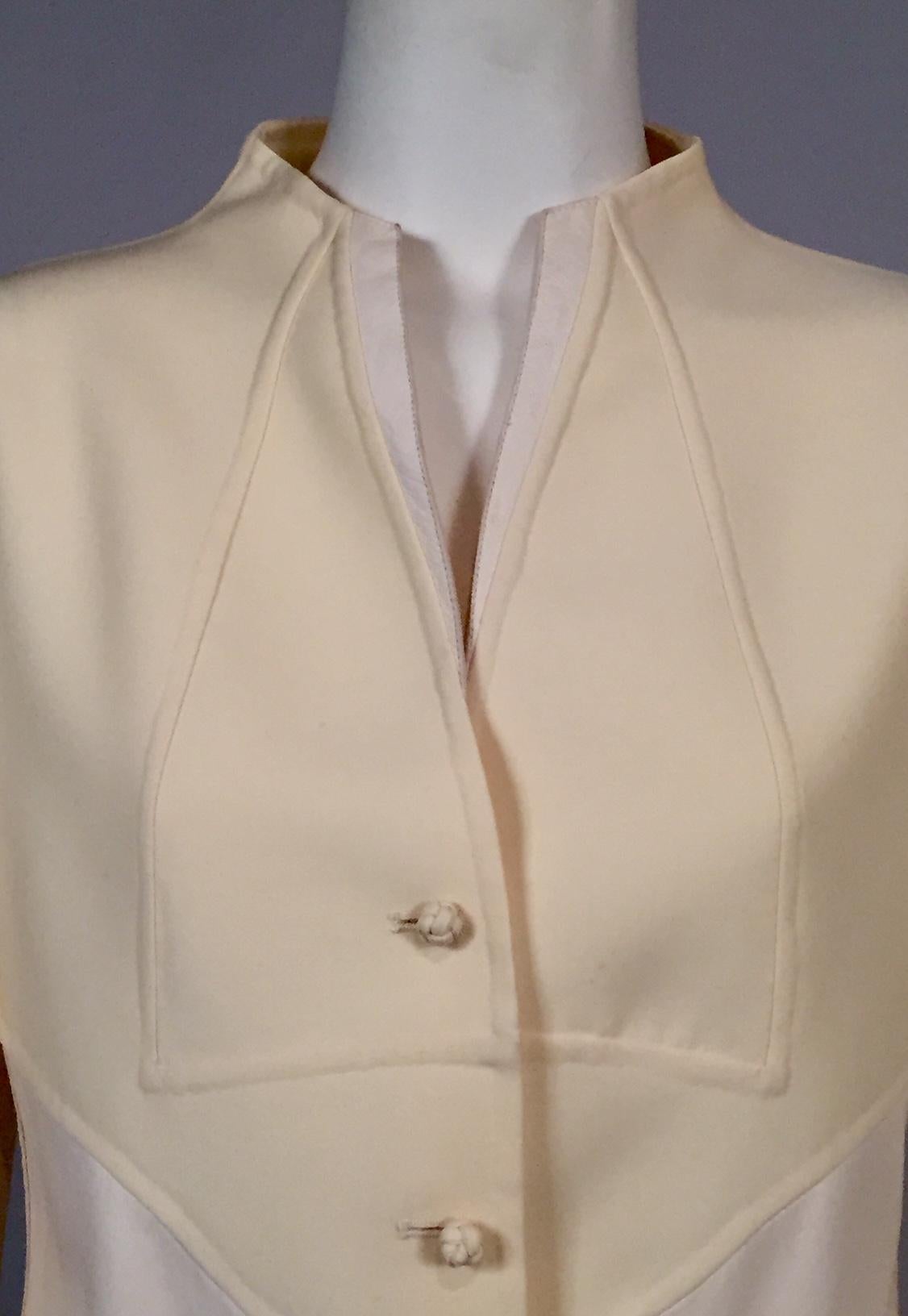 The workmanship in this jacket is fantastic, the attention to detail and hand finishing is a testament to the superb quality that Ralph Rucci is known for. The collarless jacket has a leather edged front opening above five wool knot buttons and two