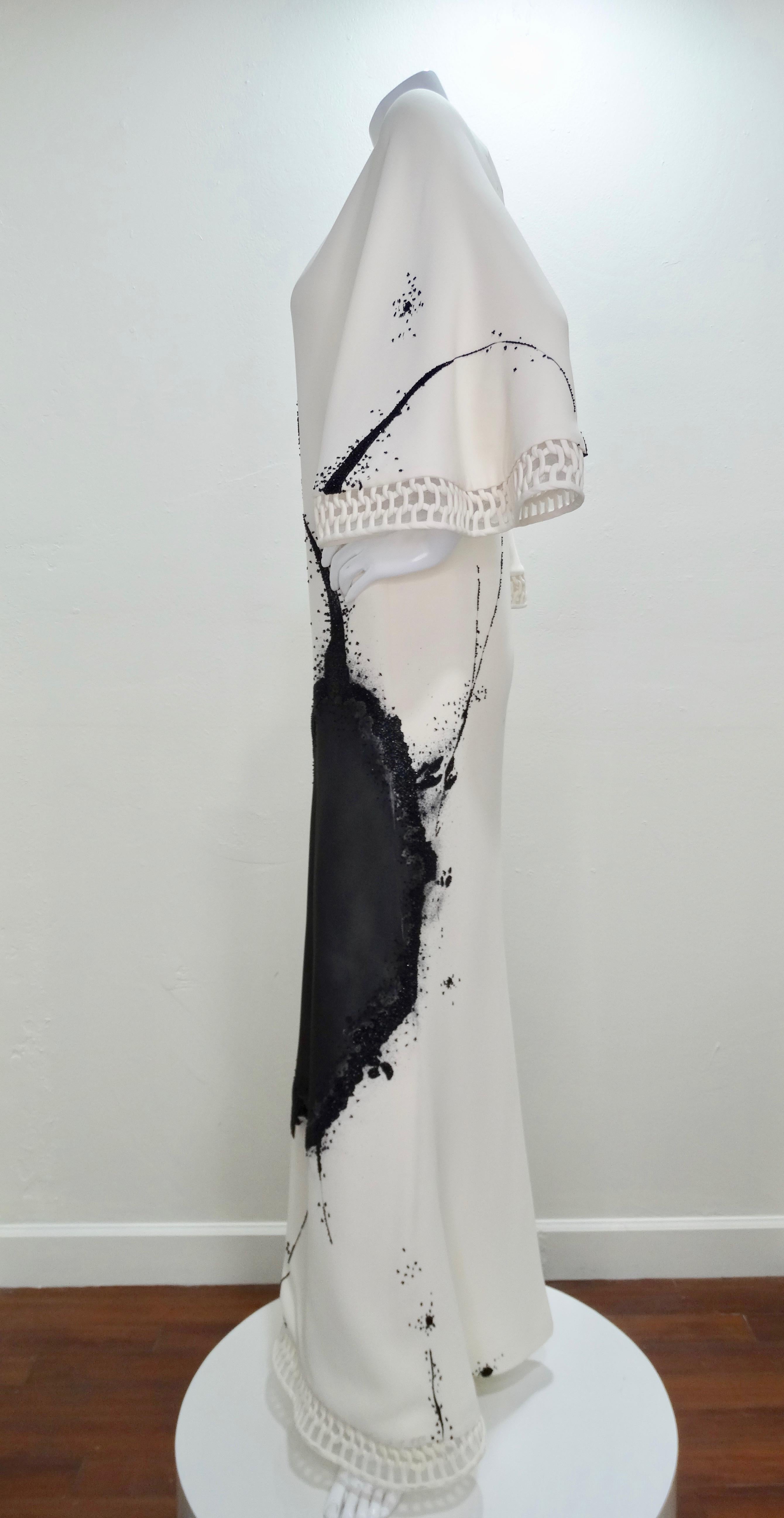 Stunning custom made evening dress from Ralph Rucci's Chado line. Made from Silk, this floor length gown features an abstract splatter/ink blot design embellished with tiny hand sewn black beads. Includes an intricately braided hem, zipper closure