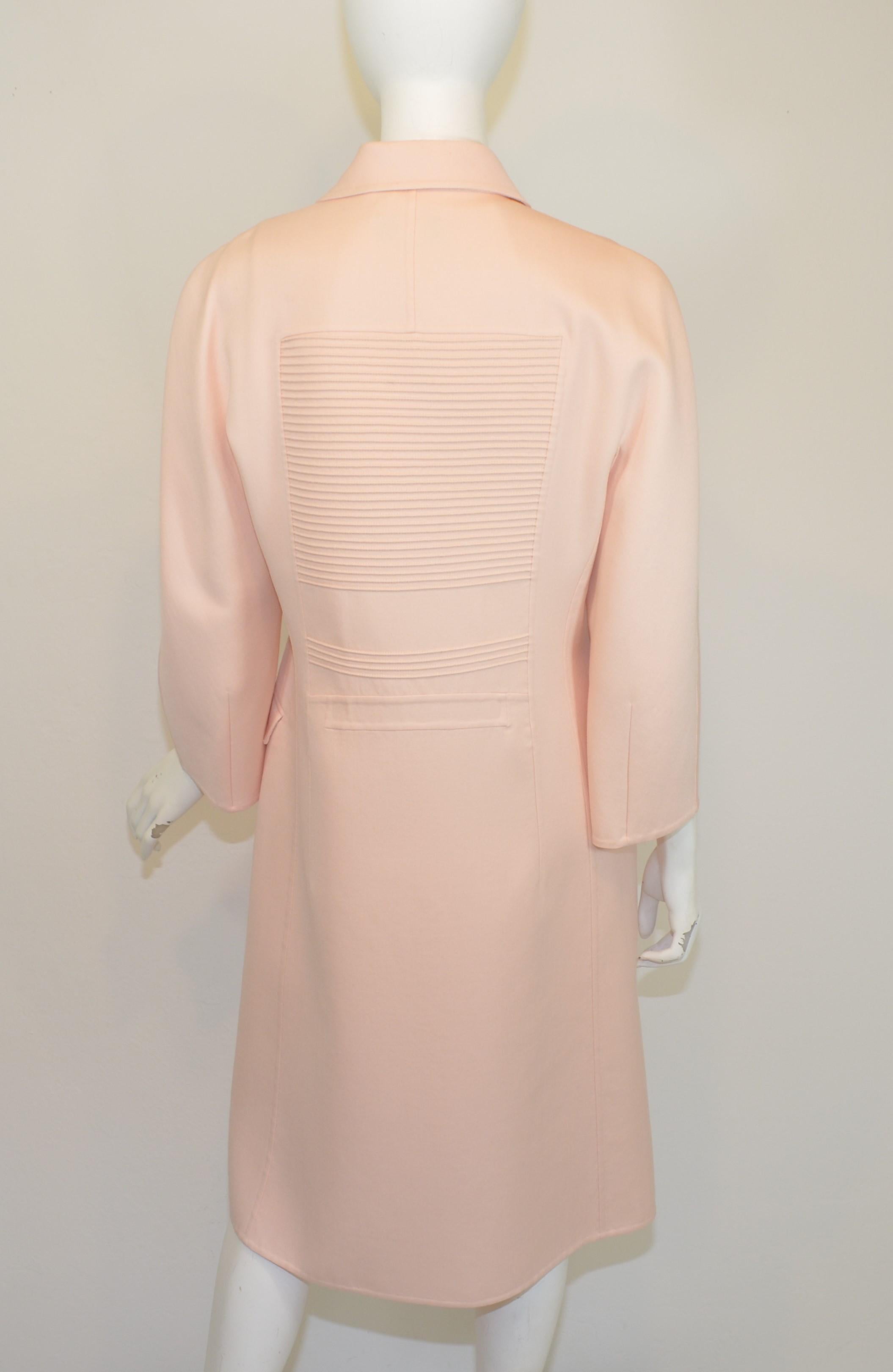 Chado Ralph Rucci dress and coat ensemble. Coat has a ribbed/pintucked detail with button fastenings and pockets at the hips, fully lined. Dress has an A-line design with a back zipper fastening. Labeled size 8, made in USA.

Measurements:
Coat -