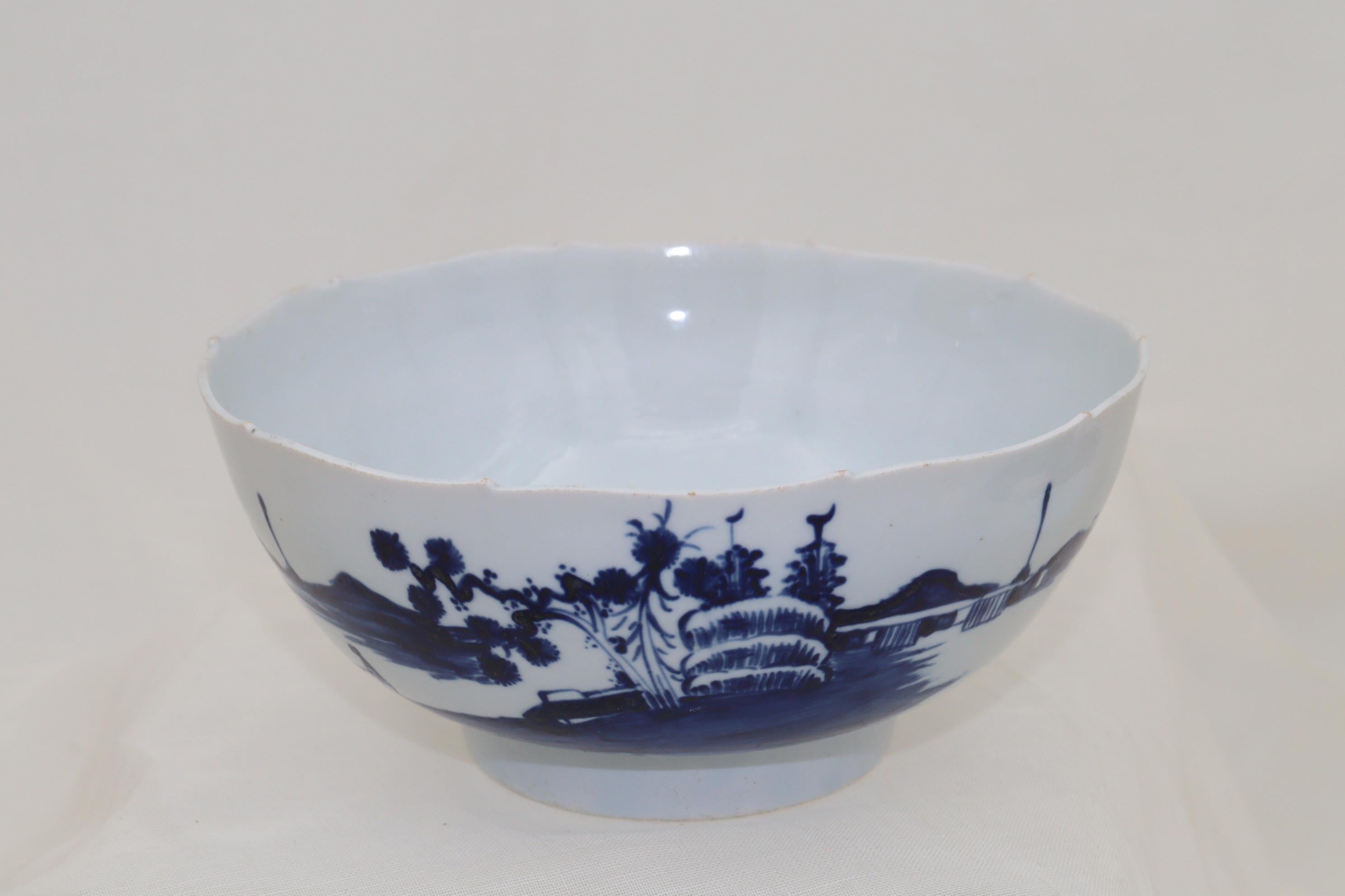 This porcelain bowl is by Richard Chaffers of Liverpool and is decorated with the hand painted blue and white 