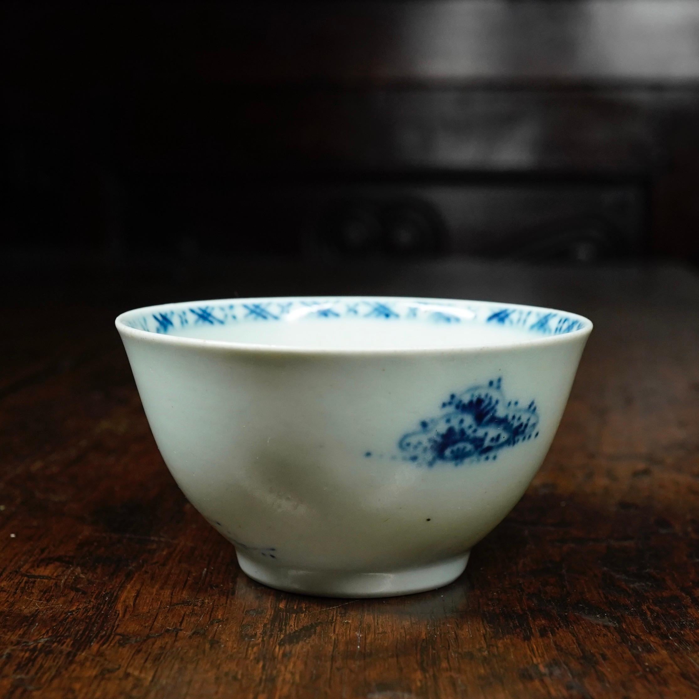 Liverpool teabowl, Richard Chaffers & Co of Shaw's Brow, decorated underglaze in a curious 'dot' technique with a version of the 'Trellis Fence' pattern, with large areas of white porcelain between islands, the interior with a thin band of lattice