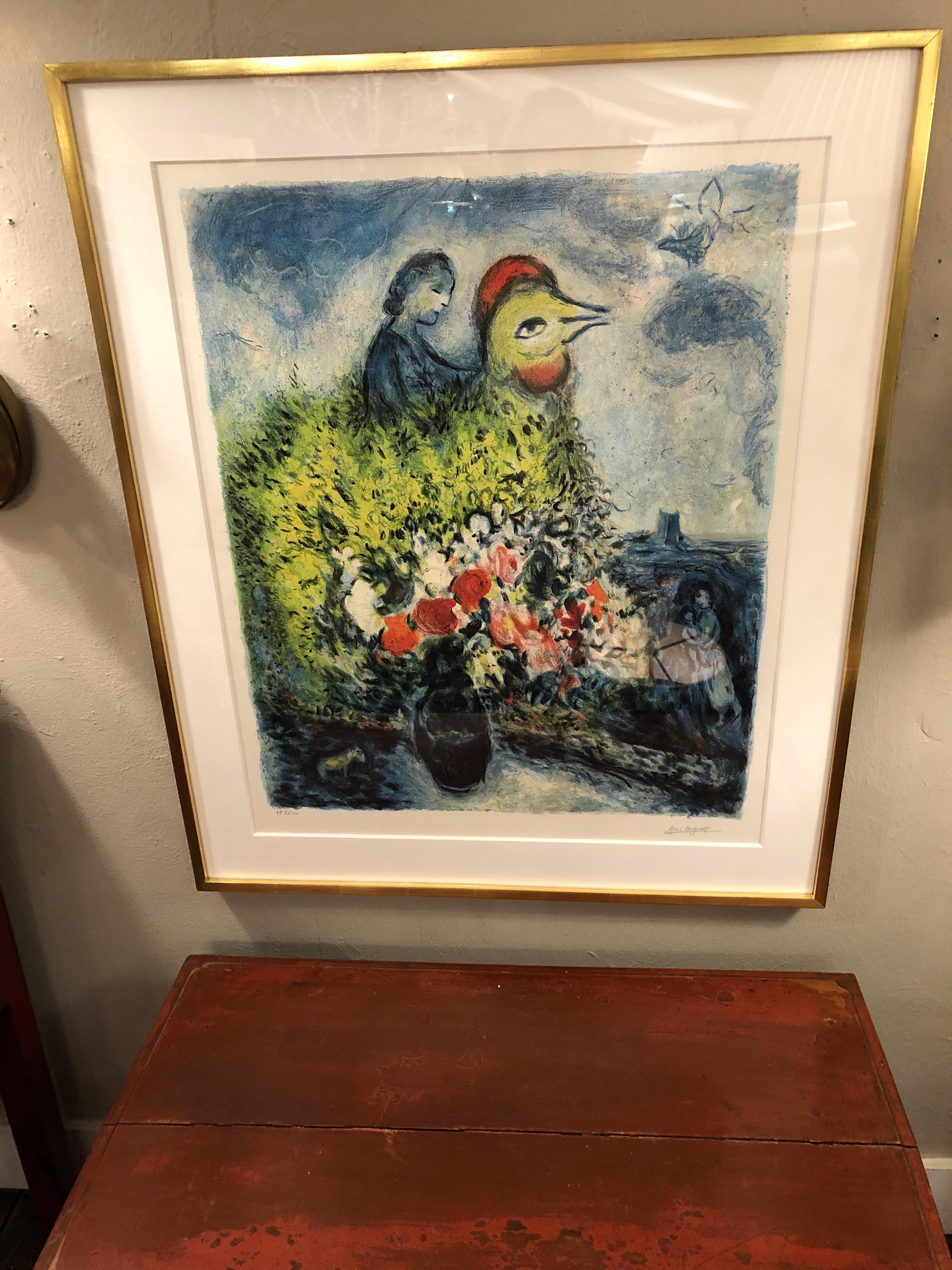 A woman is riding a top a large rooster with a yellow bouquet in this whimsical fantastical limited edition print by Marc Chagall (Russian/French, 1887-1985) 
# 18/500 limited edition, signed by the artist, embossed stamp by the signature.
Newly