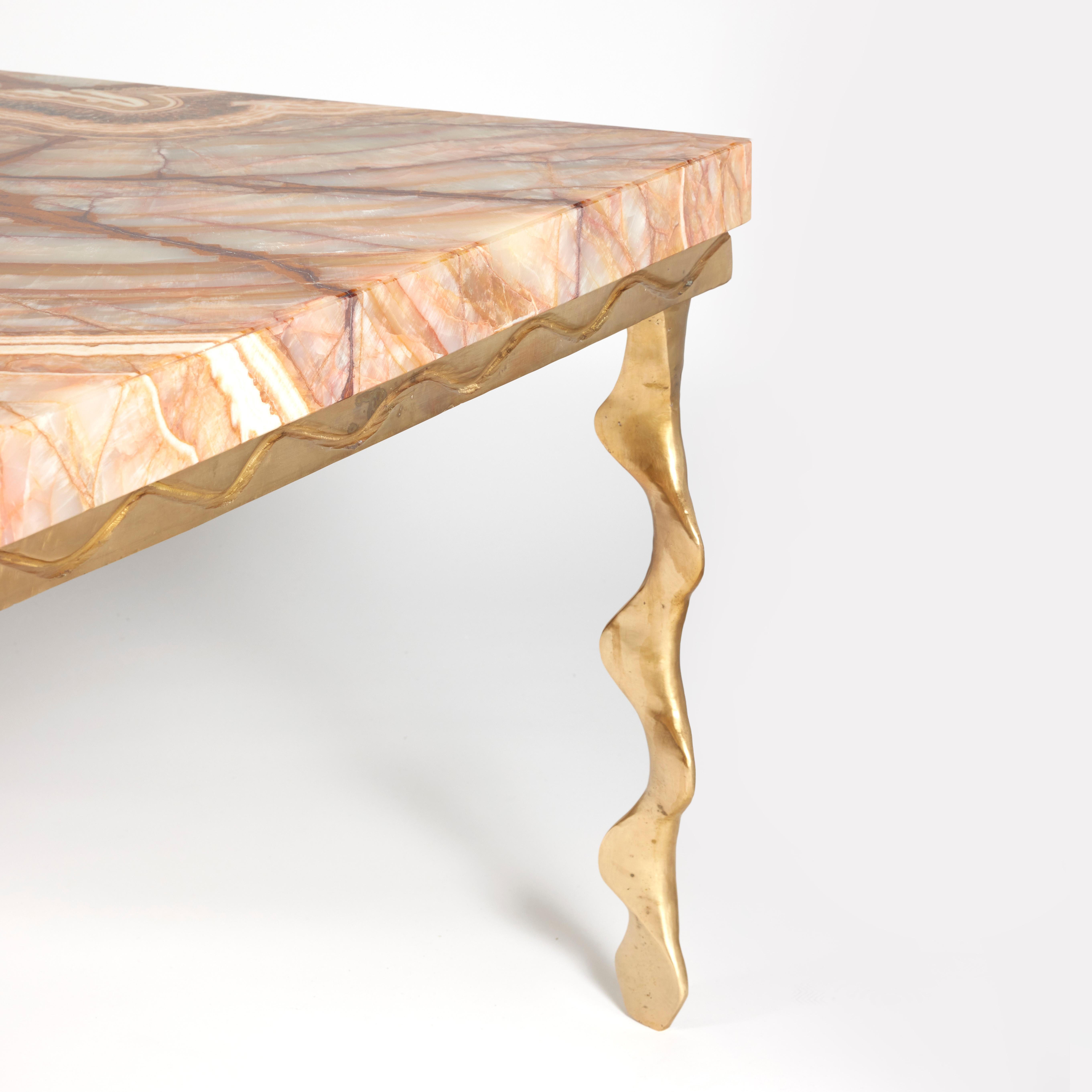 Rectangular coffee table with hand cast twisted bronze base and marble top.
 