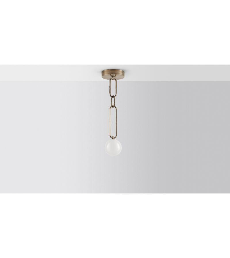 Chain chain chain pendant light by Volker Haug.
Dimensions: Diameter 28 x H 20 cm. 
Material: Brass. 
Finish: Polished or bronzed brass
Lamp: : 12V G4 LED.
Weight: Approx. 4 kg
Available in finishes: Polished, Aged, Brushed, Bronzed,