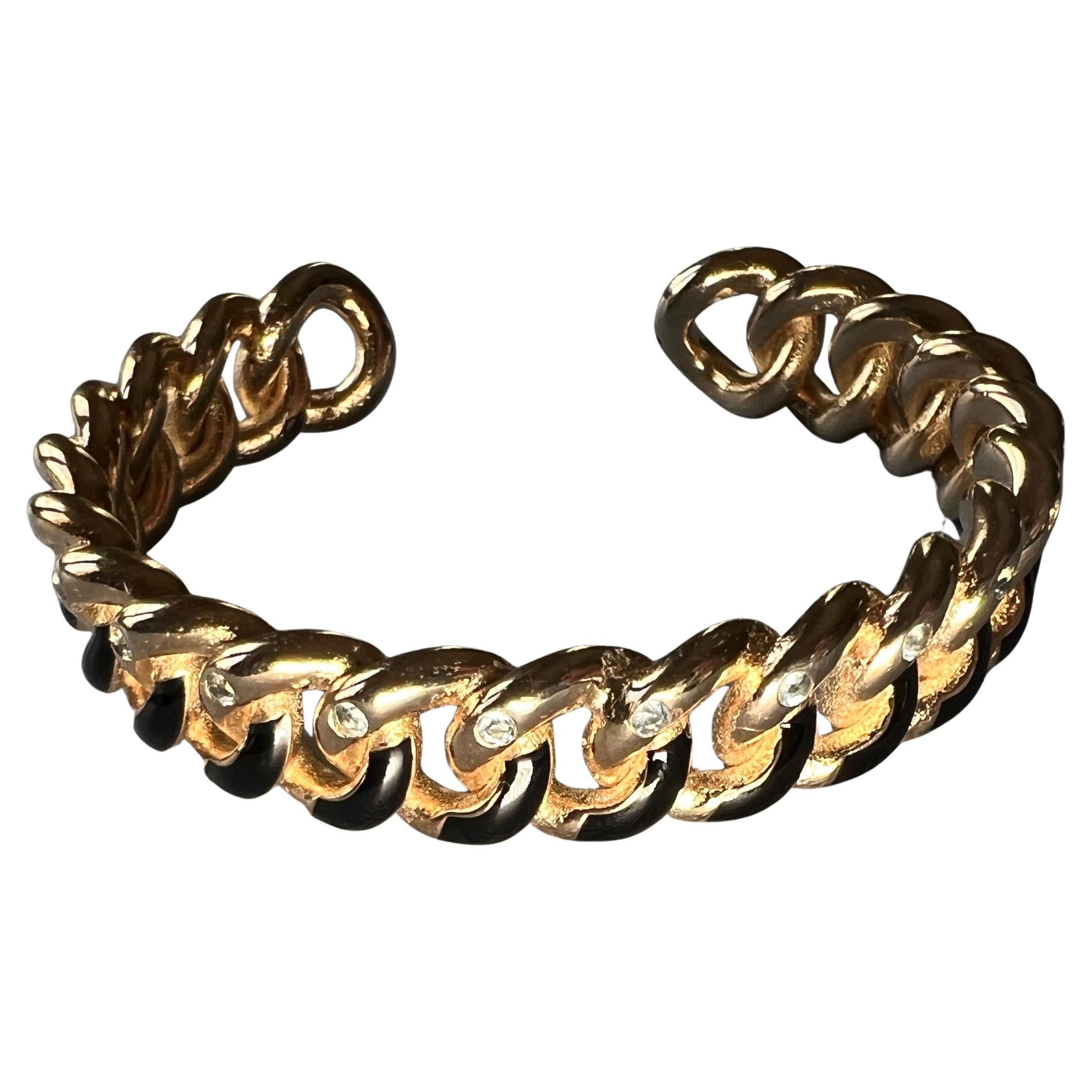 Cuff  Bracelet Aquamarine Black Enamel

This incredible J DAUPHIN Cuff in 14 k Gold plate and handpainted Black Enamel has Aquamarines on each link. Its a very refined and unique, stands out as a statement piece.

This Bracelet is called Shekinah,