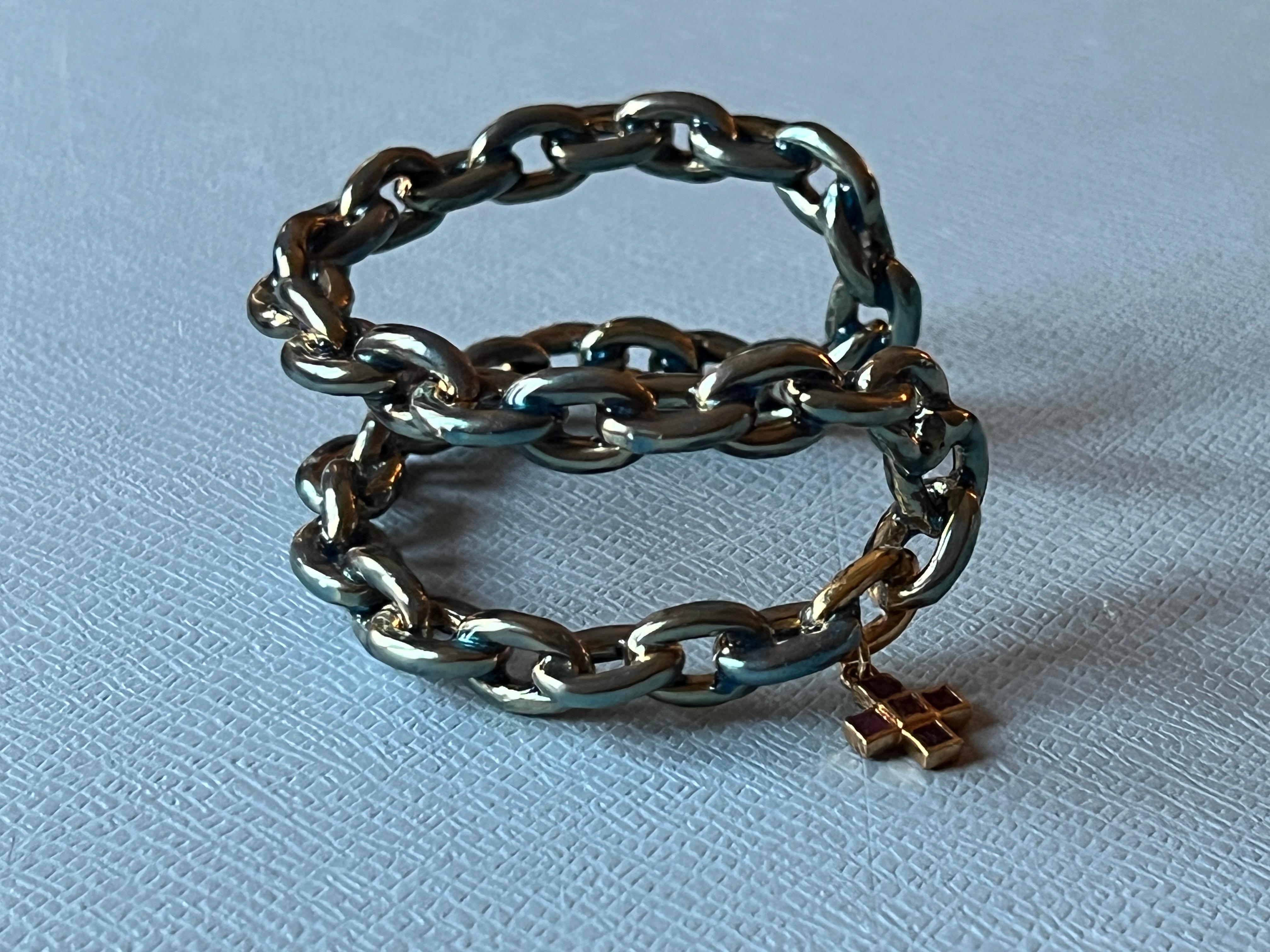 Chain Cuff Bangle Bracelet Light Blue Enamel and Ruby Cross 

Material Gold plated Brass
Handpainted Light Blue Enamel
Designer J Dauphin

The Cuff bangle has a cross which is one of the oldest and most universal symbols found across various