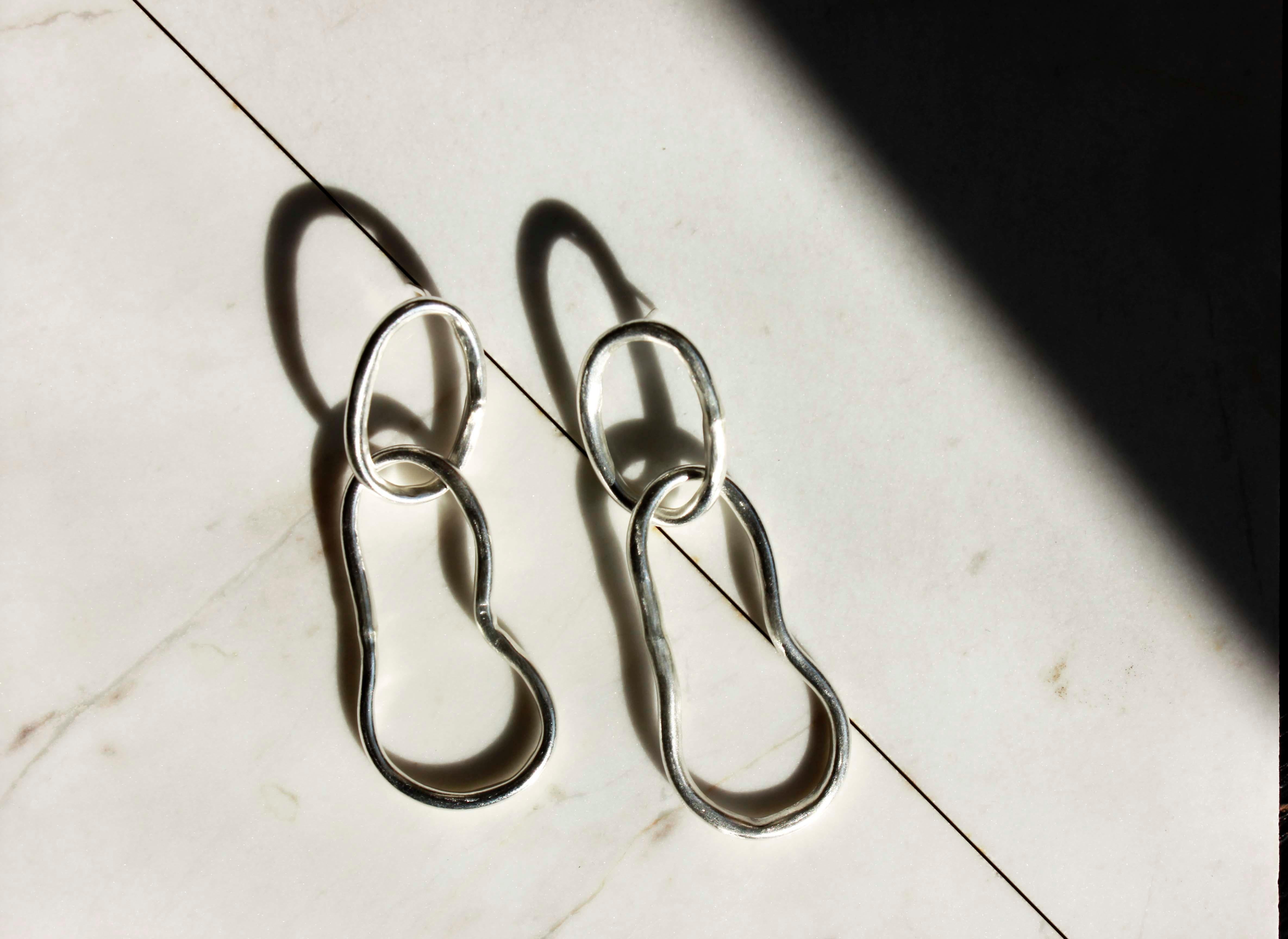 These long chain earrings are made from eco fine silver.

A statement piece that can be worn all day long, with a nice volume which will add a bold detail to your outfit.

The earrings have a playful movement.

The earrings are really light as they