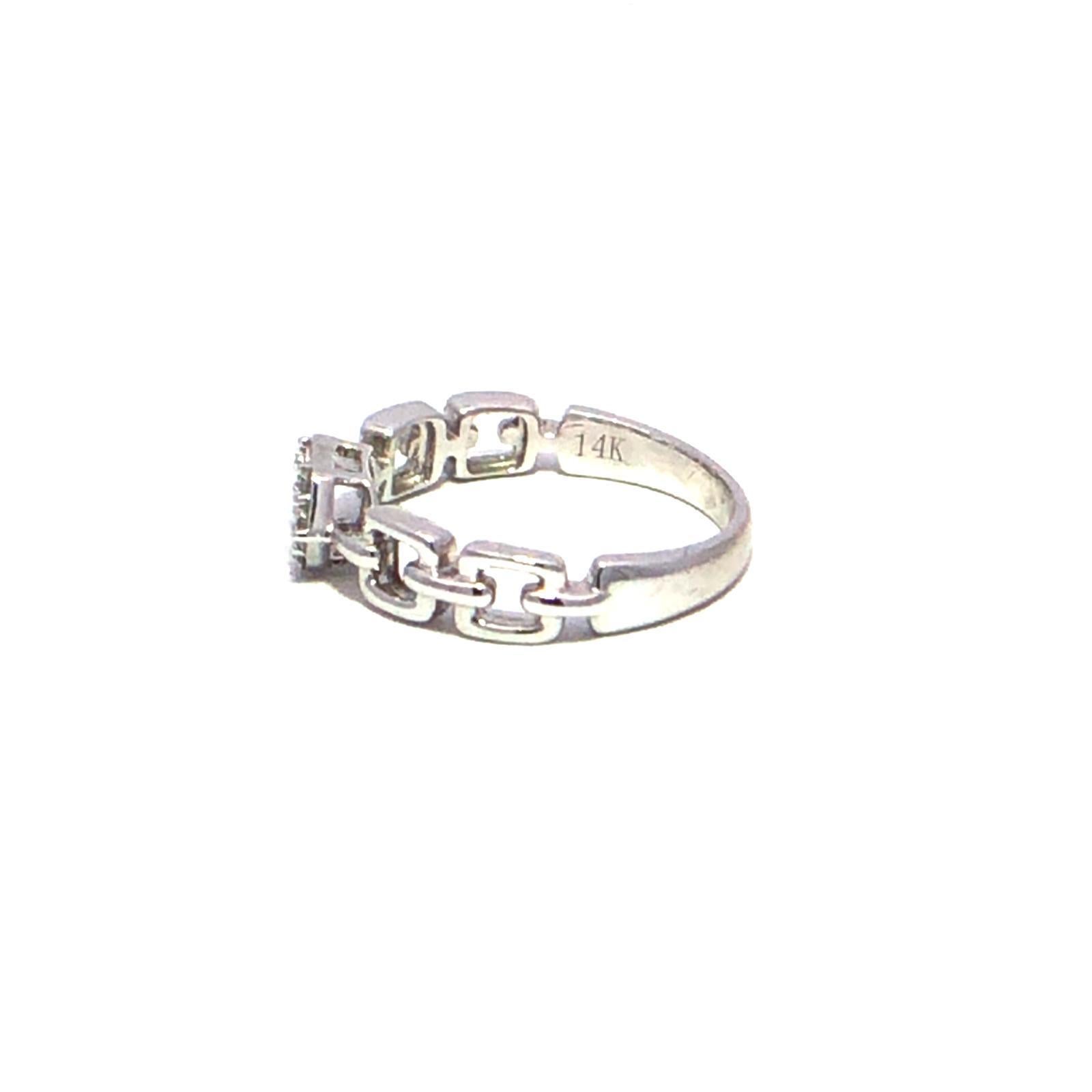 Elevate your elegance with this stunning 14k white gold ring, featuring a breathtaking round and baguette cut diamonds at its center. Weighing in at .23 carats, the diamond sparkles brilliantly, capturing light from every angle and adding a touch of