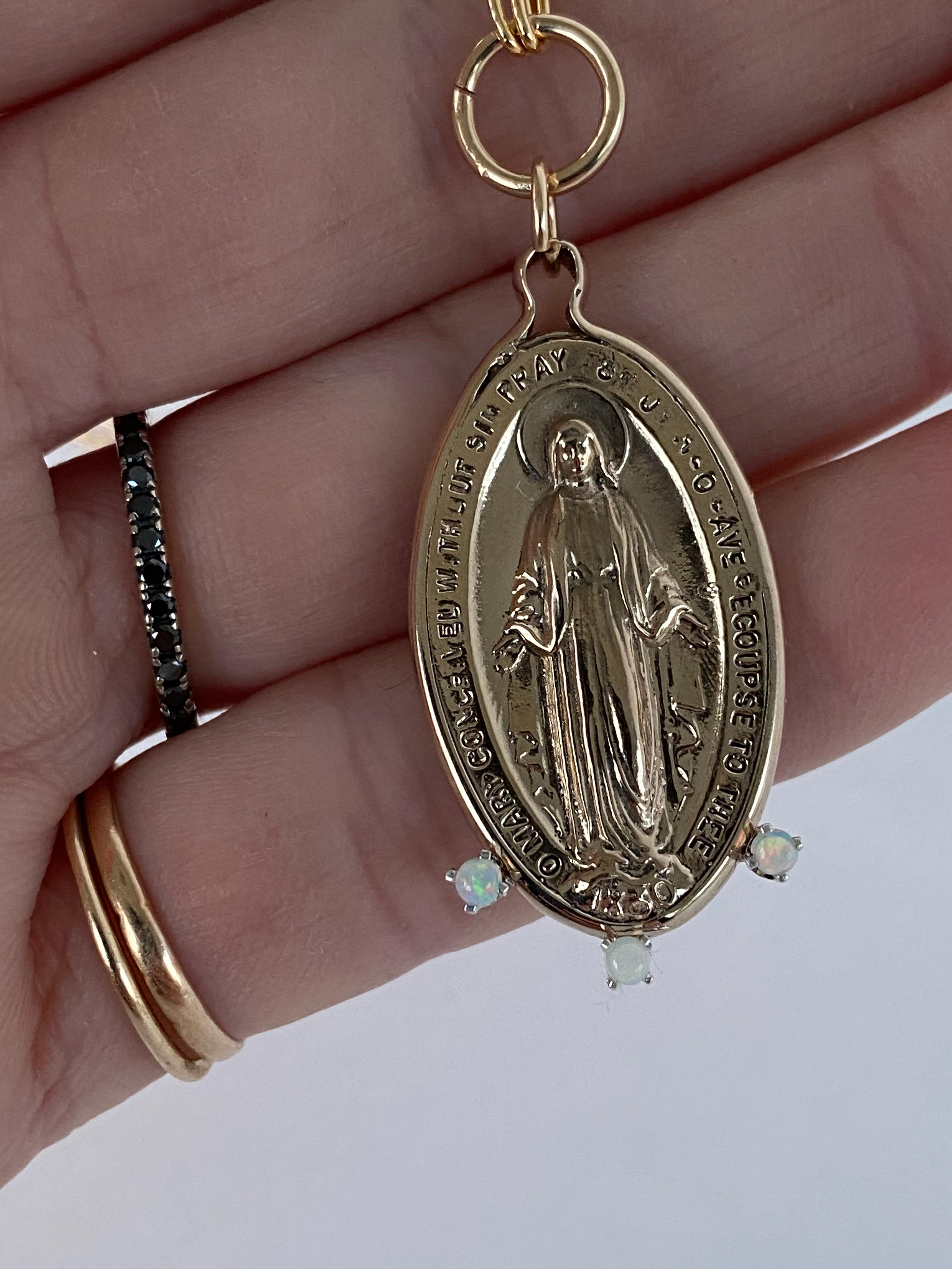 Chain Necklace Medal Virgin Mary Miraculous Opals Oval Pendant Bronze J Dauphin

Exclusive piece with Virgin Mary Miraculous Medal pendant with 3 Opals. The Chain is 24' long but can be made shorter or longer on request.

This item is called