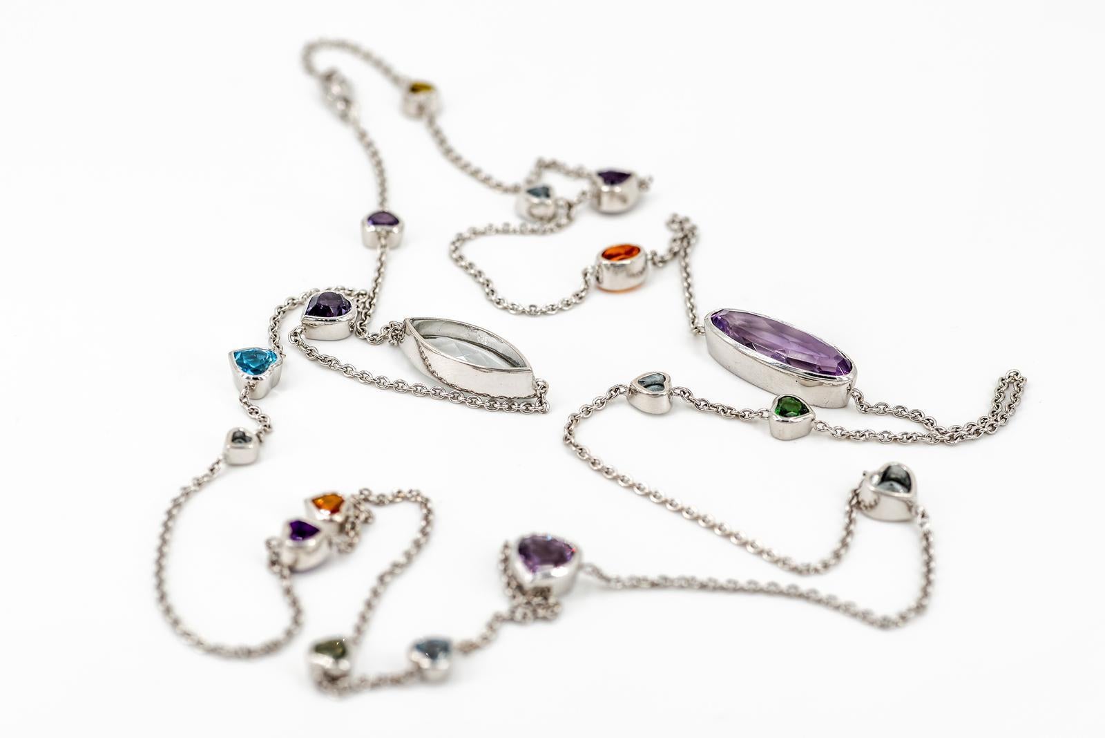 Beautiful necklace. 18 carat white gold. punched. total weight: 25 g.
Stones set with multiple oval amethyst (20 mm x 8 mm). Acute diamond Marine (20 mm x 8 mm). sapphire orange. green sapphire. tsavorite oval. sapphire jaune.Peut be put in several