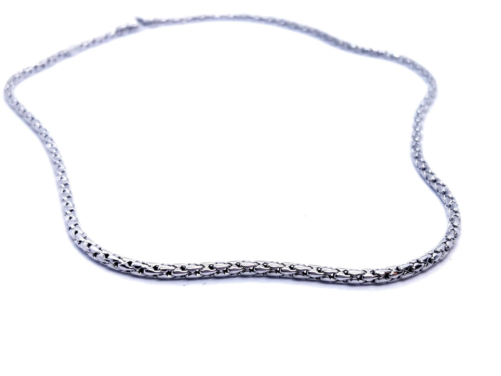 white gold necklace 750 mils (18 carats). length: 45.5 cm. width: 0.29 cm. total weight: 15.18 g. punched excellent condition
