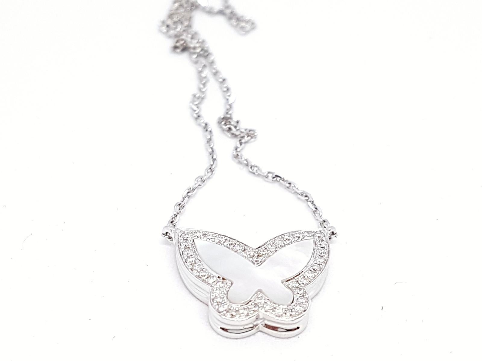 Butterfly pendant pearl and diamonds for envy 0.20 ct. size 1 cm x 1.5 cm. chain 750 thousandths white gold (18K) size 40 cm. total weight: 4.64 g. punched. Excellent condition
