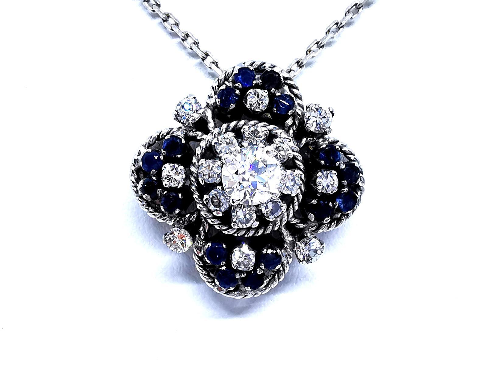 Beautiful vintage necklace. white gold 750 thousandths (18 carats). pendant set with a brilliant cut central dialant GH SI approximately 0.70 ct. 16 brilliant-cut diamonds GH SI around 1.16 carats in total. and 16 round sapphire. diamond total