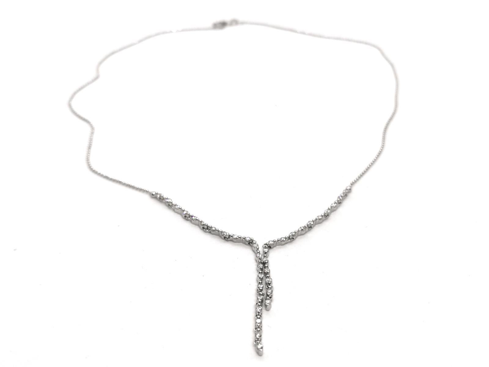 Necklace white gold 750 thousandths (18 carats). semi rigid. composed of 36 diamonds of 0.015 carat. unit set half closed-claws distributed over two rows of different lengths.  length: 40 cm. total weight 5.26g. excellent condition
