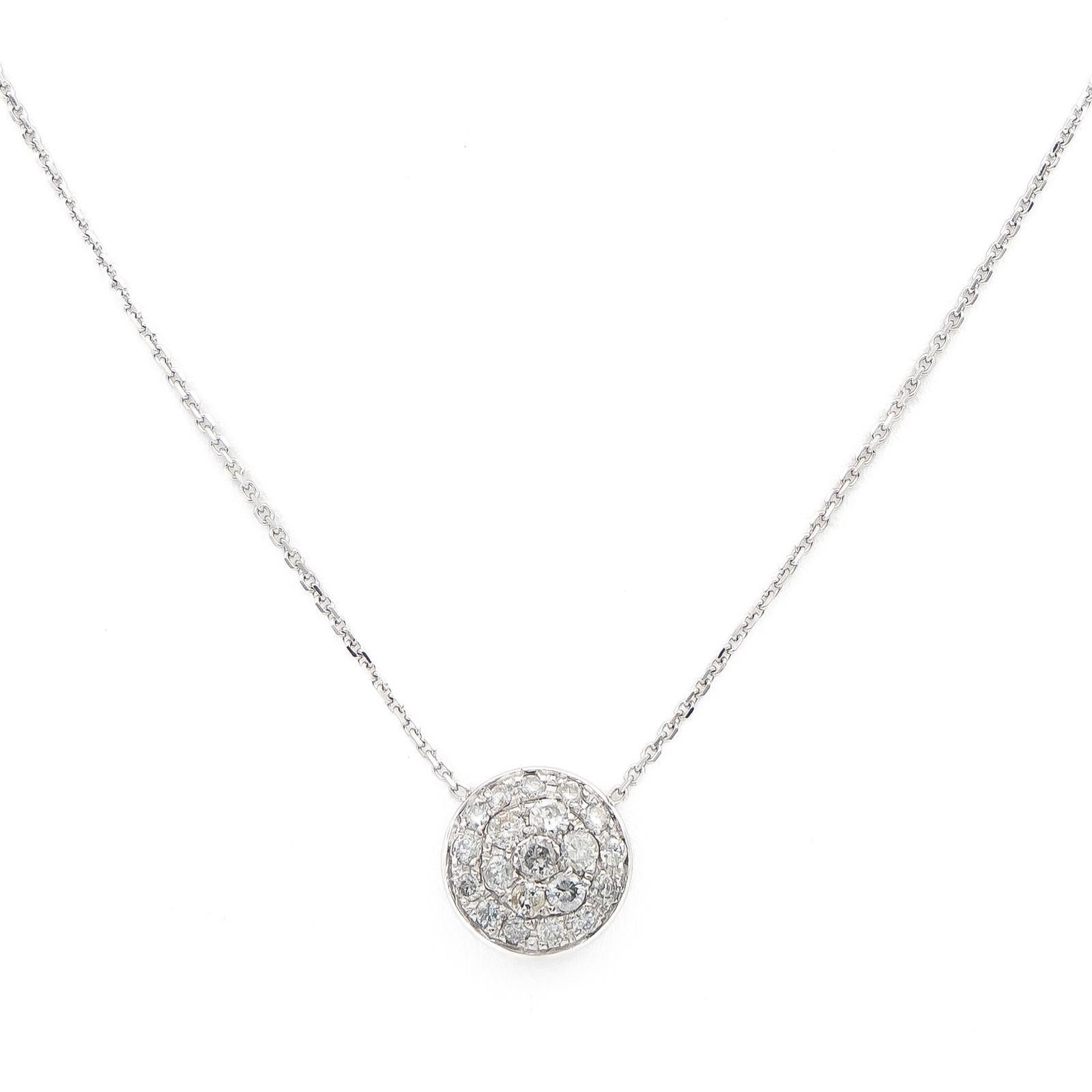 White gold necklace 750 thousandths (18 carats). circular pendant paved with diamonds. chain mesh convict. 20 brilliant-cut diamonds. total weight diamonds: about 0.655 ct. (1 diamond of about 0.065 ct. 6 diamonds of about 0.055 ct each. 13 diamonds