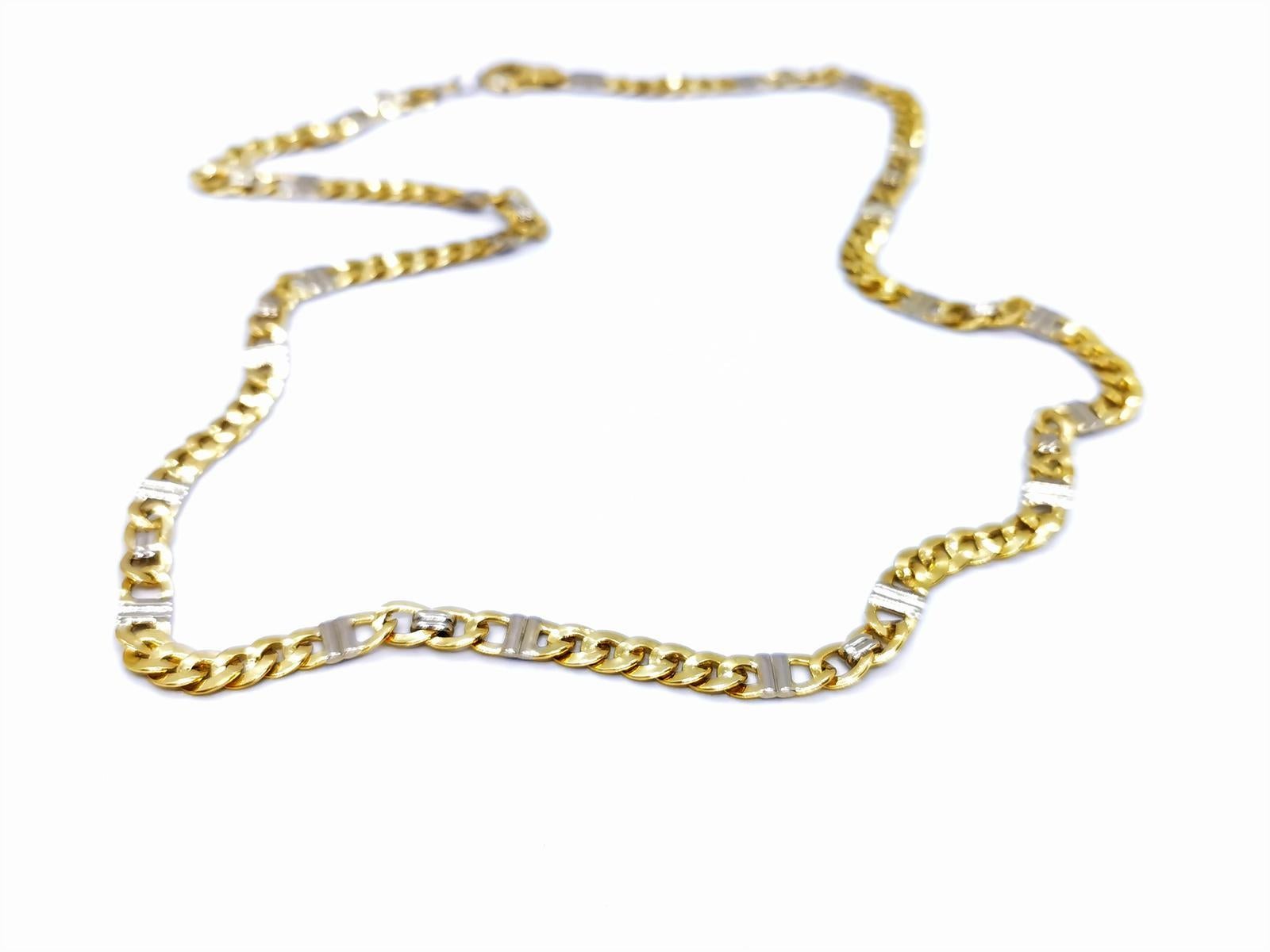 Necklace yellow and white gold 750 mils (18 carats). articulated link chain. length: 60 cm. width: 0.6 cm. total weight: 43.22 g. punched. excellent condition
