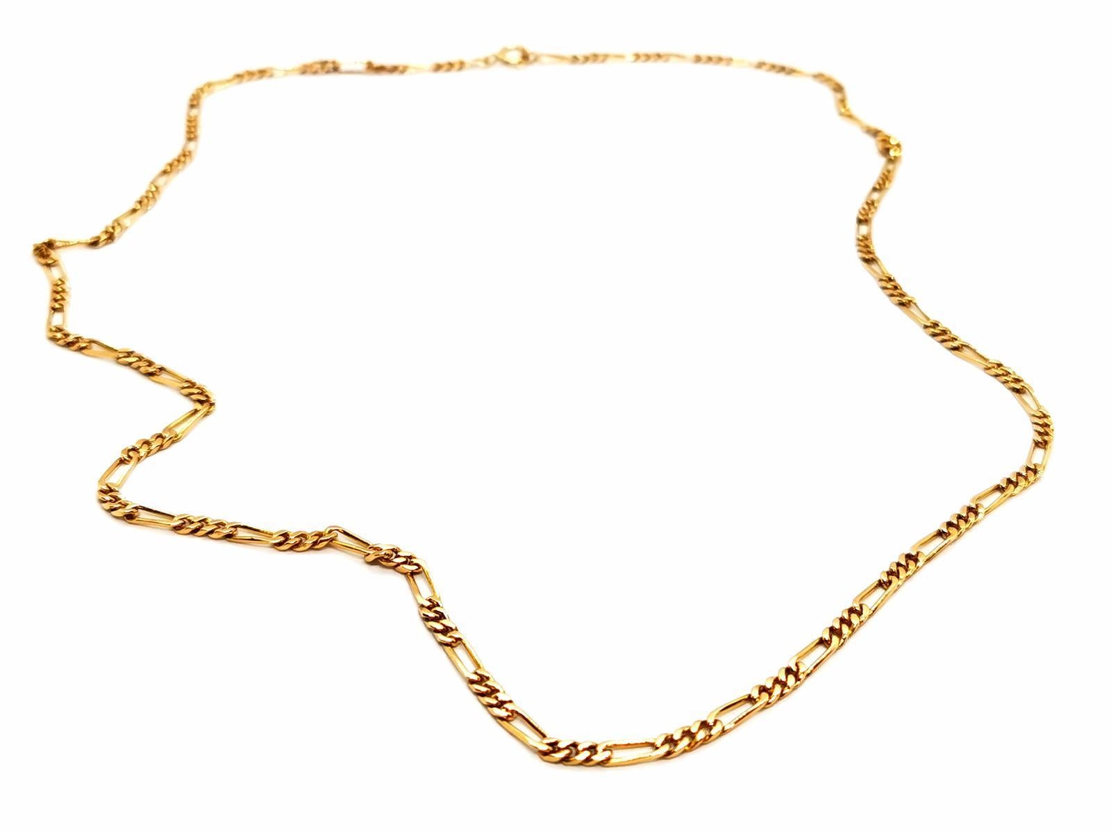 Necklace in yellow gold 750 thousandths (18 carats). alternating mesh. length: 62.5 cm. width: 0.28 cm. total weight: 18.71 g. Owl hallmark. excellent condition.
