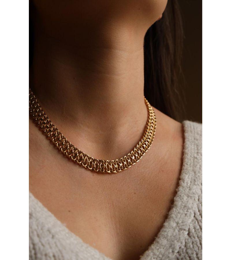 Necklace in yellow gold 750 thousandths (18 carats). fancy mesh with safety eight. length: 46 cm. width: 1.1 cm. total weight: 33.30g. eagle head hallmark. excellent condition
