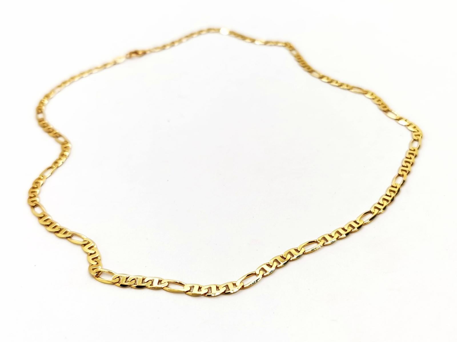 Necklace in yellow gold 750 thousandths (18 carats). figaro mesh 2x1. length: 45cm. width: 0.39cm. Link thickness: 0.10cm. weight: 11.95gr. eagle head hallmark. excellent condition.
