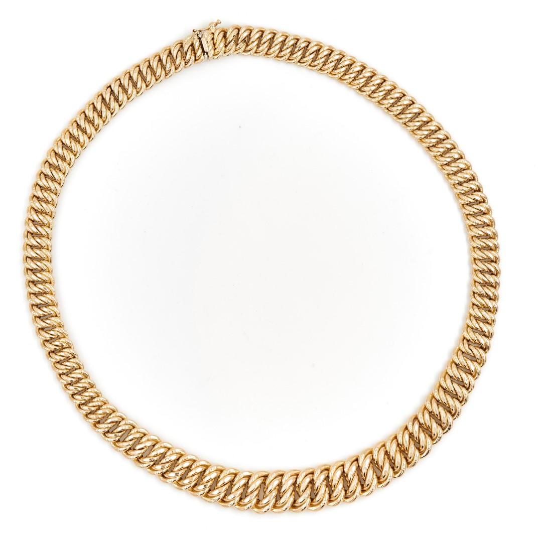 Necklace in yellow gold 750 thousandths (18 carats). American mesh in fall. closure in eight safety. 
length: 45.5 cm. width: 0.89 and 1.40 cm. thickness: 0.55 cm 
total weight: 32.35 g. eagle head hallmark. excellent condition.
