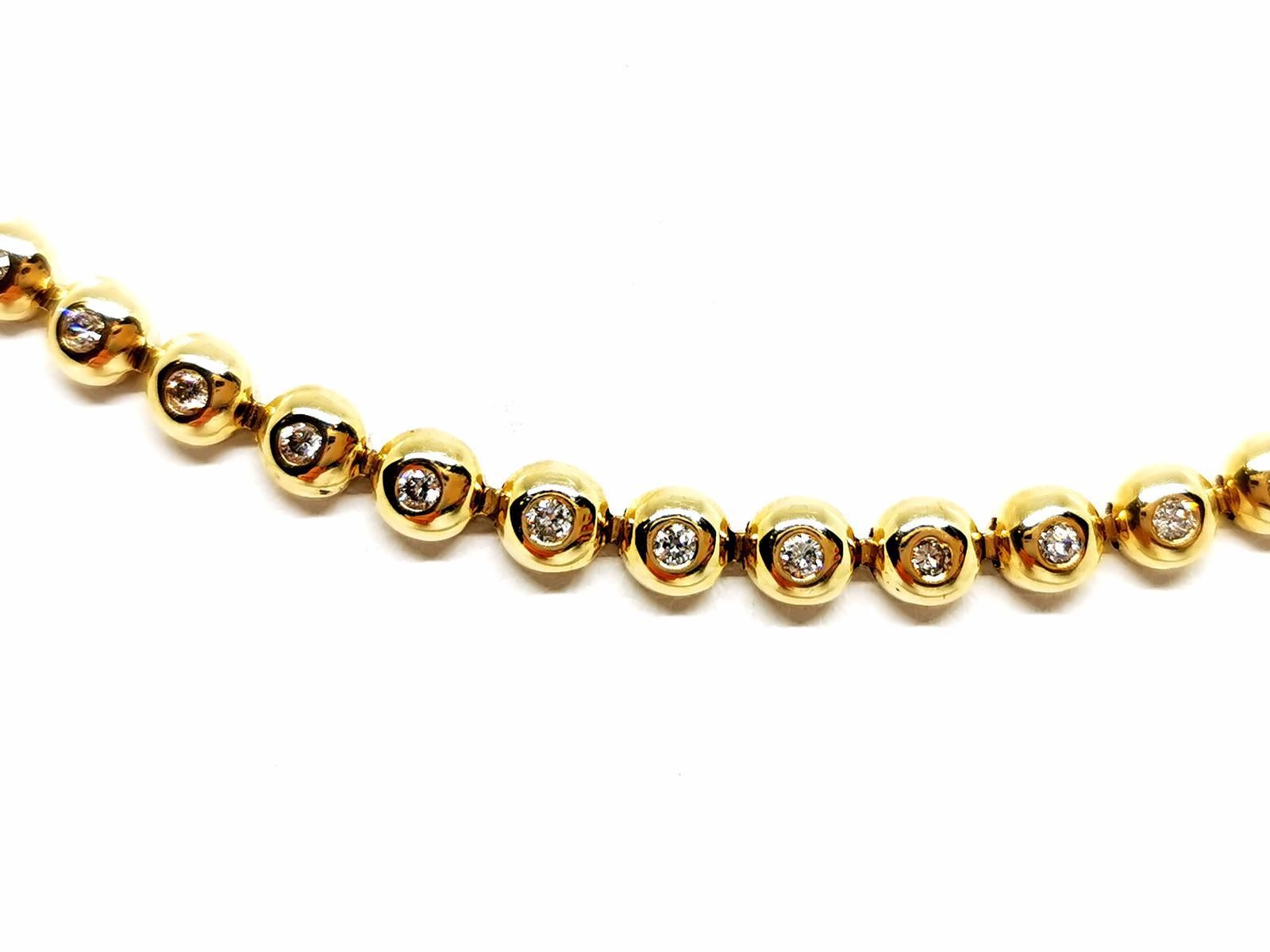 Gold necklace yellow 585 mils (14 carats). diamond line crimped closed. compound 83 brilliant cut diamonds. about 0.02 ct each diamond total weight: about 1.66 carats. length: 44 cm. width: 0.48 cm. thickness: 0.25 cm. with eight safety clasp. total