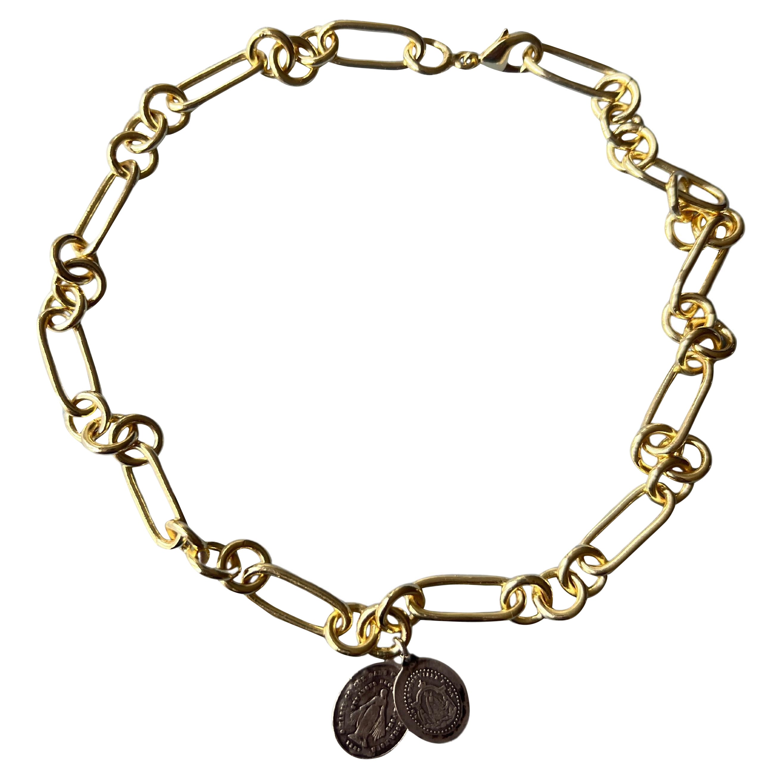 Chunky Chain Choker 14k Gold Plated Brass with two thin Vintage Virgin Mary's Medals in Silver

42 Cm

Designer: J DAUPHIN 

Available for immediate delivery 