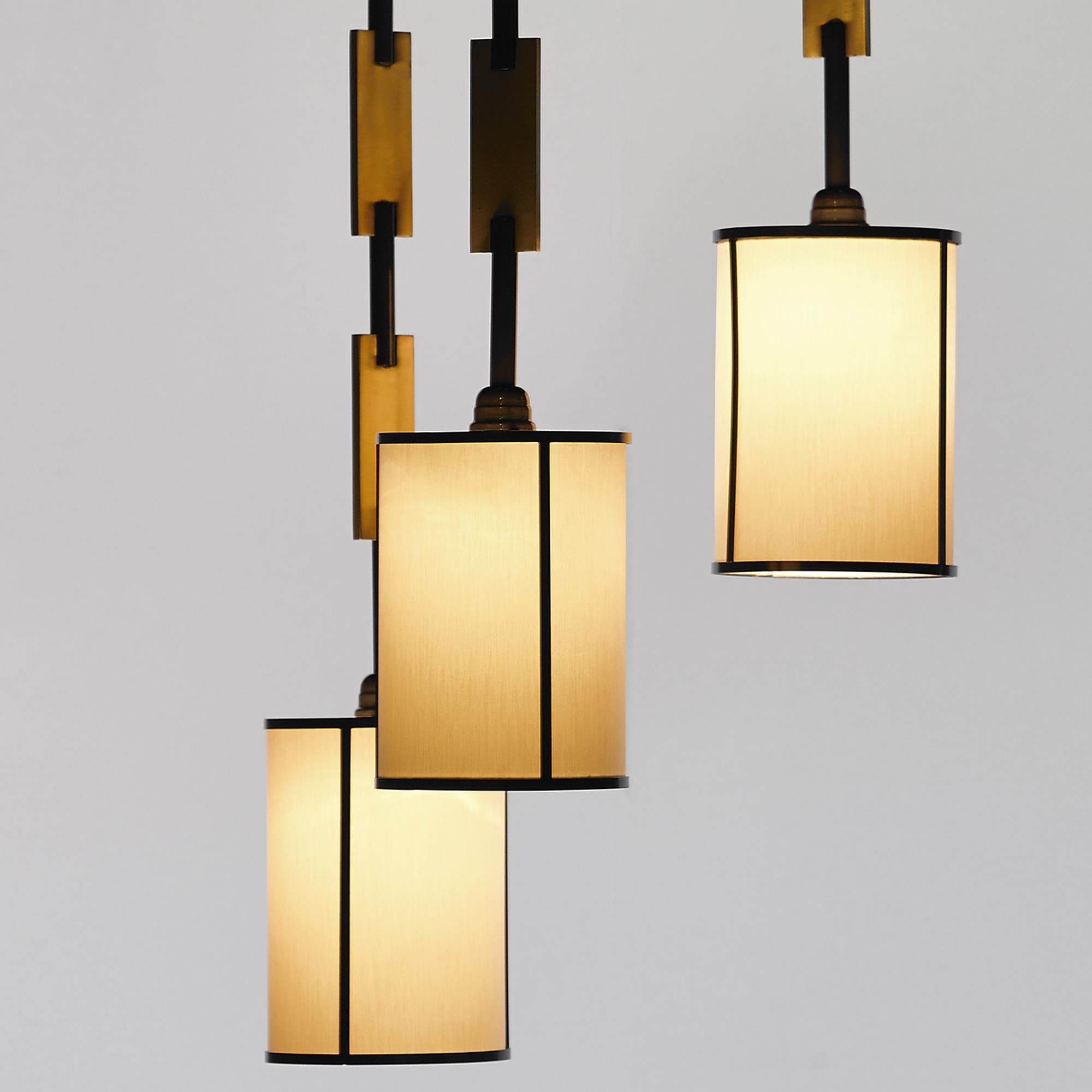 Chain Pendant Set of 3, in Brushed Brass and Dark Bronze, Handcrafted by Duistt

The CHAIN pendant light is an interesting and unique item, made up of three hanging pendants each giving a soft, warm, and inviting light. The chains are designed using