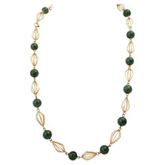 Chain set with 15 jade beads.