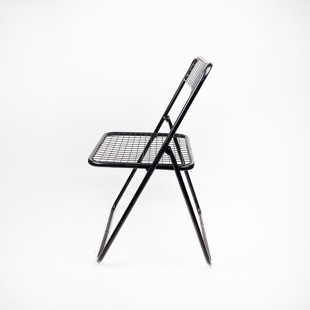 Metal Folding chair Model 085 manufactured by Federico Giner, 1970s.

Lacquered in black. Has some wear marks.

Measurements: 80 cm. high 40 cm. width 40 cm. background

Seat 40 cm. x 40cm. Seat height 44 cm.