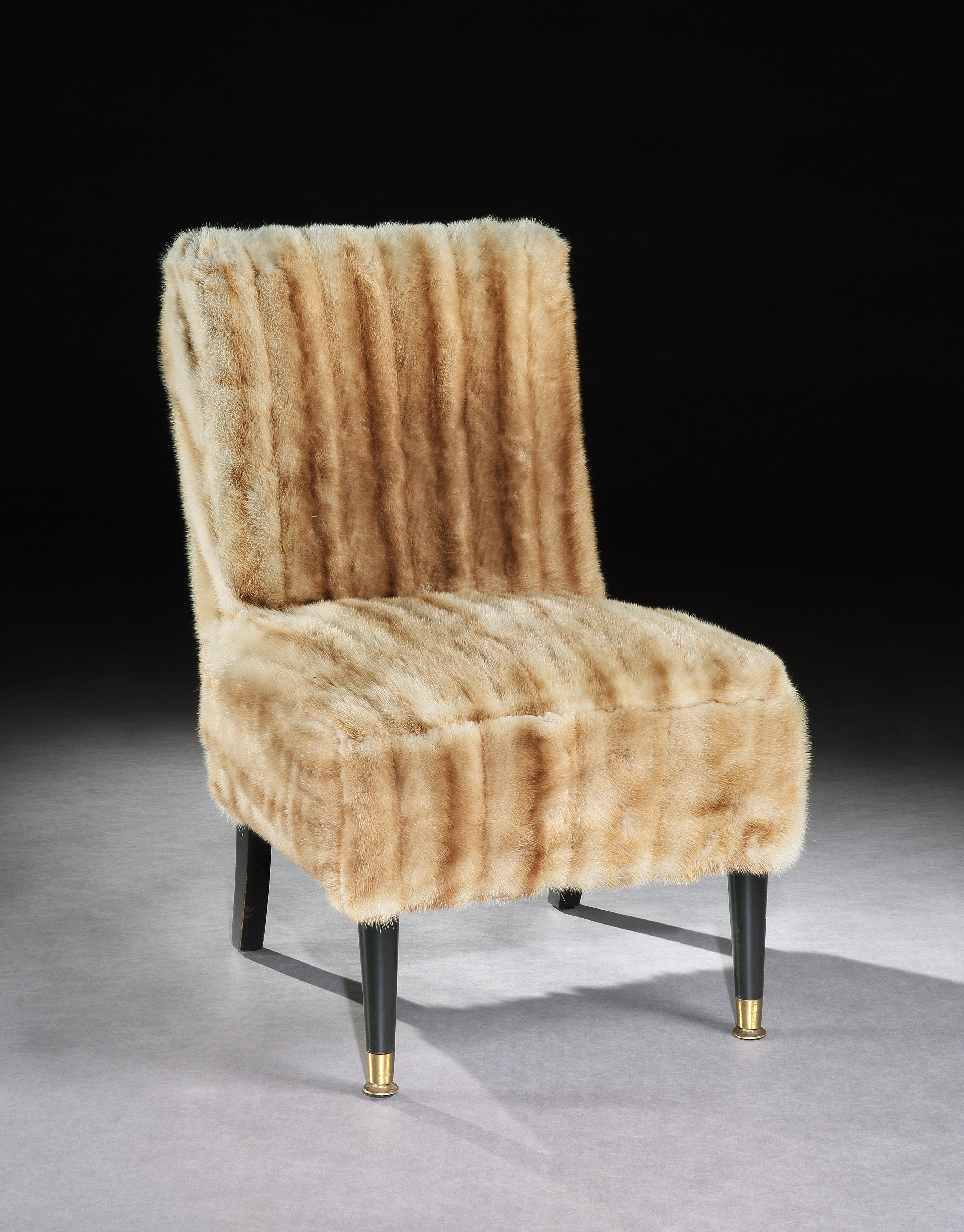 The back and seat fully upholstered in a fawn colored mink. Standing on turned ebonised front legs with brass cappings and tapering ebonised back legs.
 
Measures: Width 51 cm, 20 in.
Back height 78.50 cm, 31 in. Seat height 40.50 cm, 16