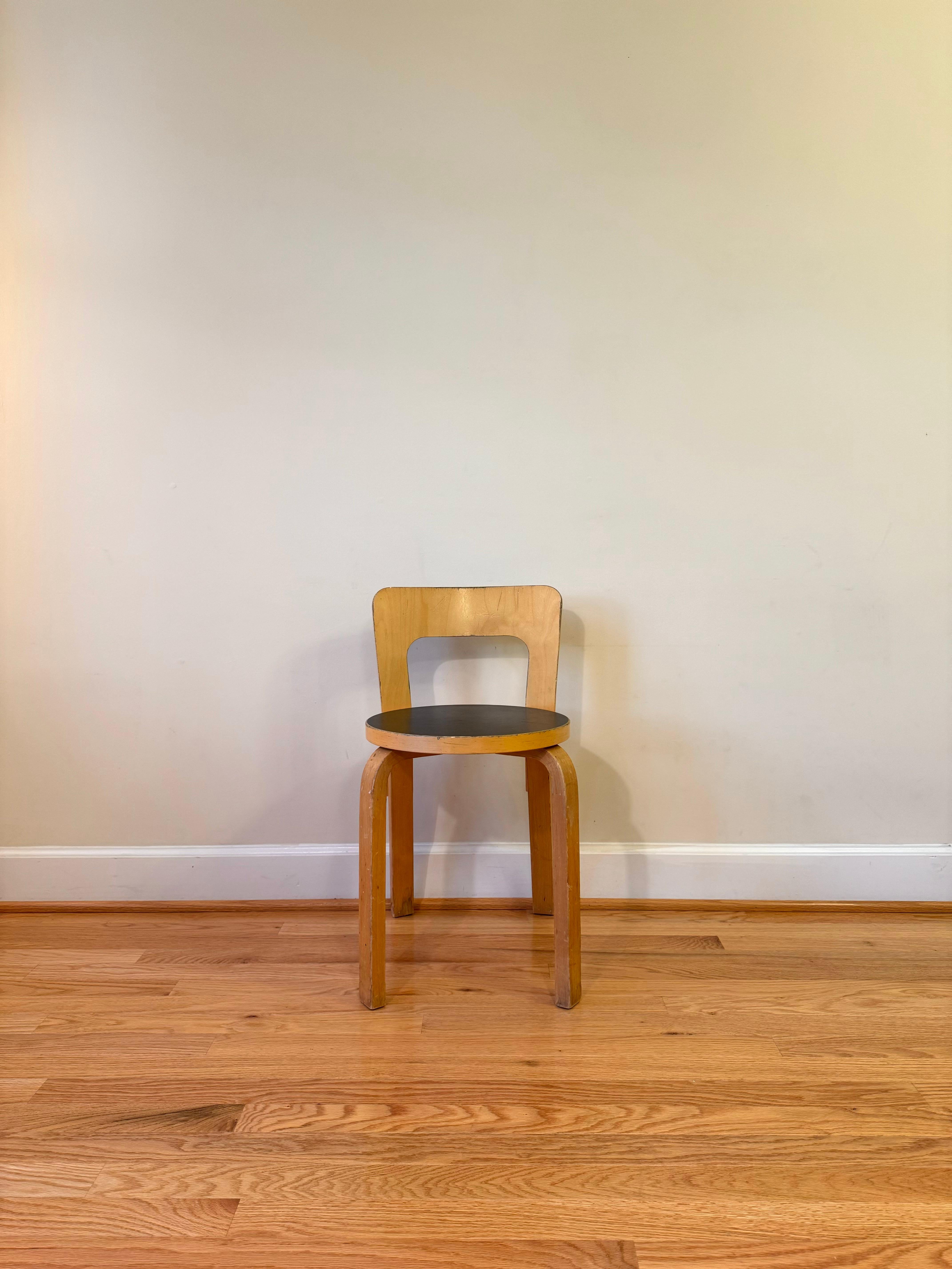 Clean lines and a simple structure define the design of Chair 65. 

A low, rectangular backrest is formed from a single piece of birch plywood and has a slight curve that forms naturally to the back, offering comfort and support. 

The height of the