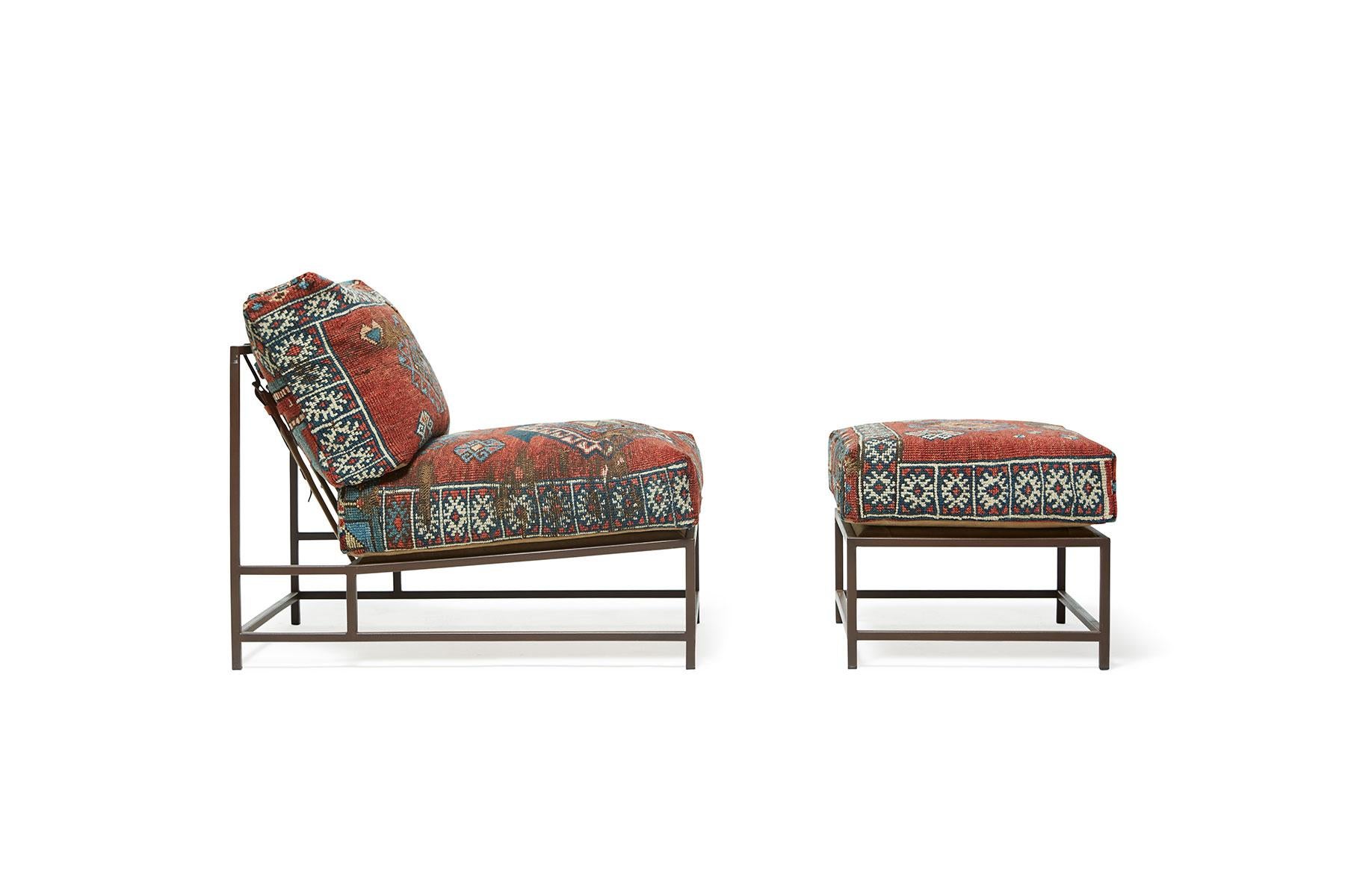 This unique chair and ottoman set in the style of Stephen Kenn's Inheritance Collection is upholstered with a 100-year-old Kazak Persian rug from the collection of Los Angeles-based King Kennedy rugs. These unique pieces have been lovingly repaired