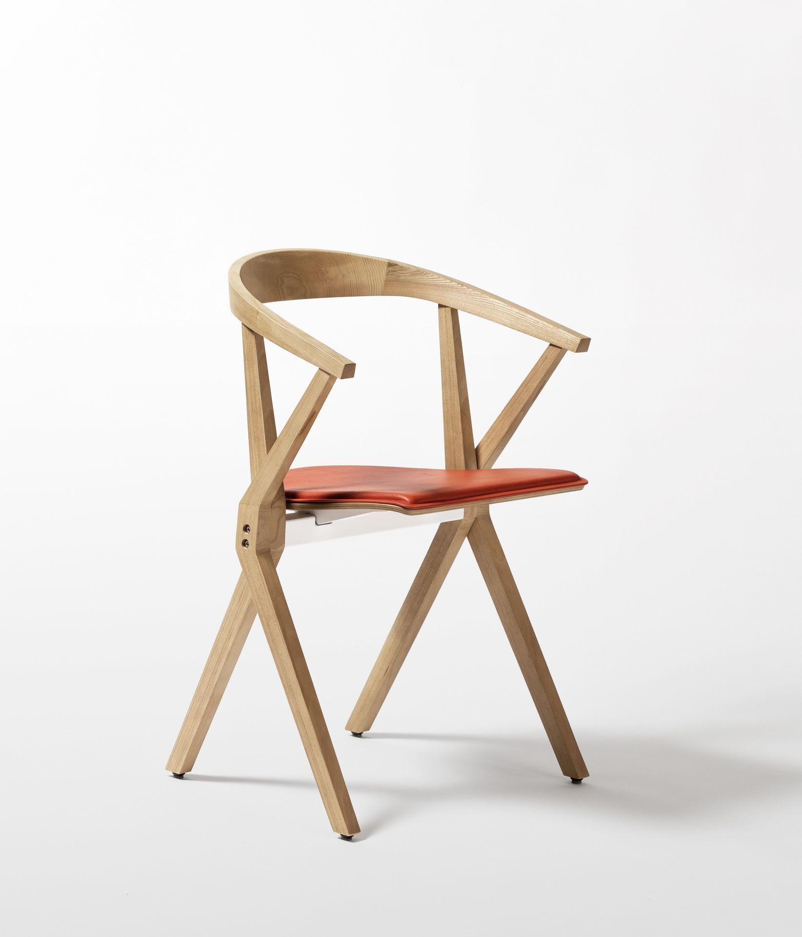 Chair B orange lacquered ash by Konstantin Grcic
Dimensions: D 48 x W 56 x H 77 cm 
Materials: The lateral sides and upper side of the seat are made of veneered beech plywood. The underside is veneered in ash wood. The backrest is made of solid