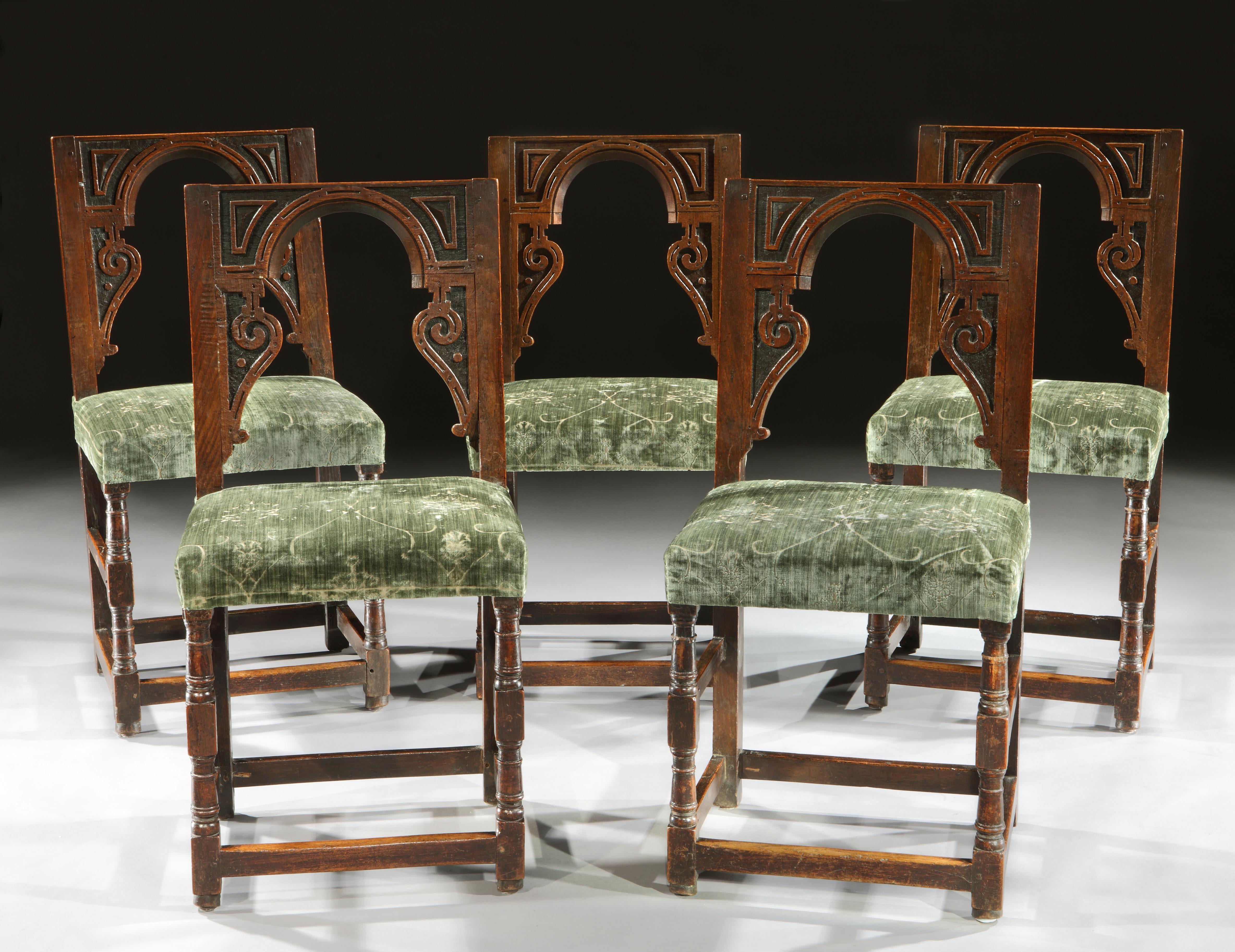 A set of exceptionally rare, English, late-Renaissance, oak, architectural, backstools upholstered in a sage green 19th century Renaissance-revival velvet

- The architectural inspired backs on these chairs are striking and they look very dramatic