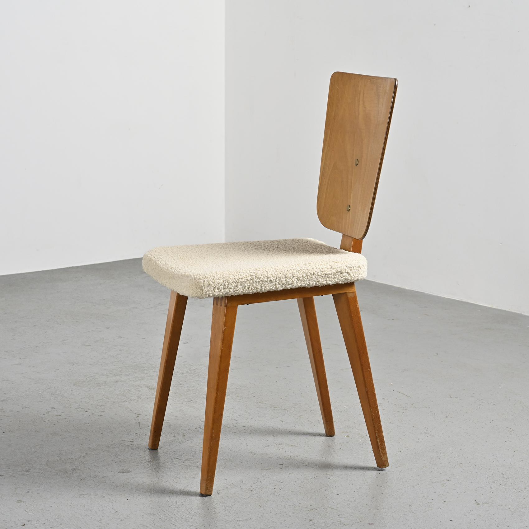 
A chair designed by André Sornay, a renowned cabinetmaker from Lyon, showcasing the designer's ingenuity as a pioneer of kit furniture in the late 1950s.

These elegant chair feature legs that are a box jointed  crafted from solid mahogany. The