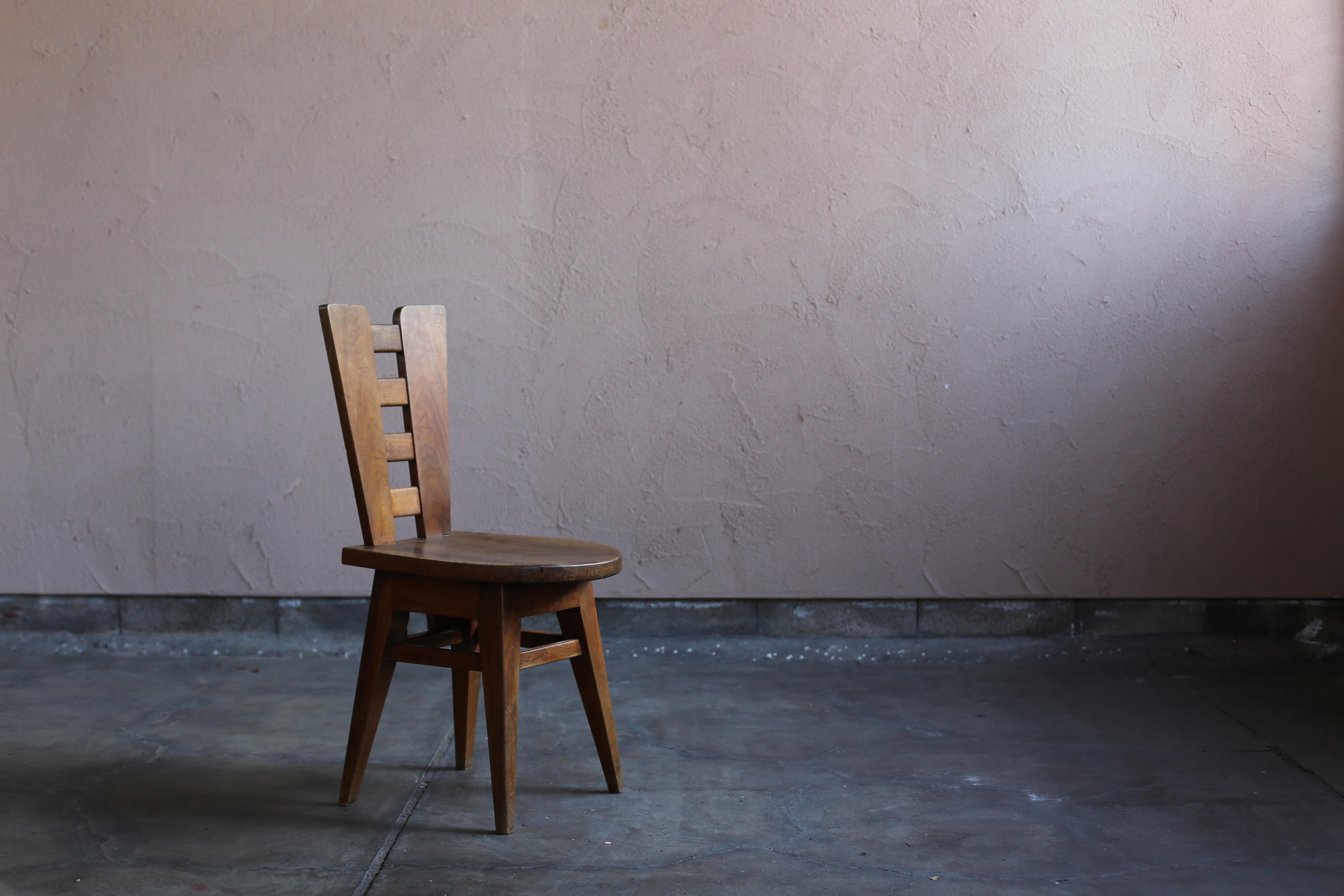 Wooden chair by French architect Henry Jacques Le Même. It is a vintage around 50s.