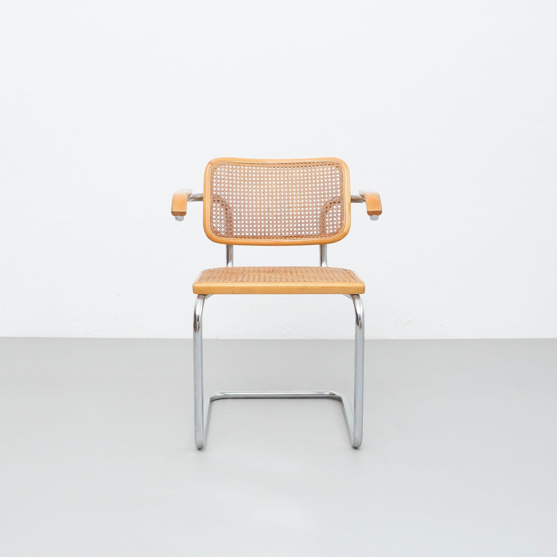 Chair designed by Marcel Breuer, manufactured by Gavina, Italy.

In original condition, with minor wear consistent with age and use, preserving a beautiful patina.
Seat has a small broken part on the