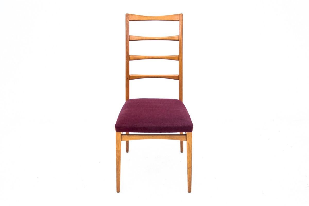 Chair from Denmark from the 1960s. Made of teak wood.

The chair has a high ladder backrest, which, due to its openwork, gives lightness to the entire form. The backrest is additionally delicately profiled, which improves seating comfort.

We have a