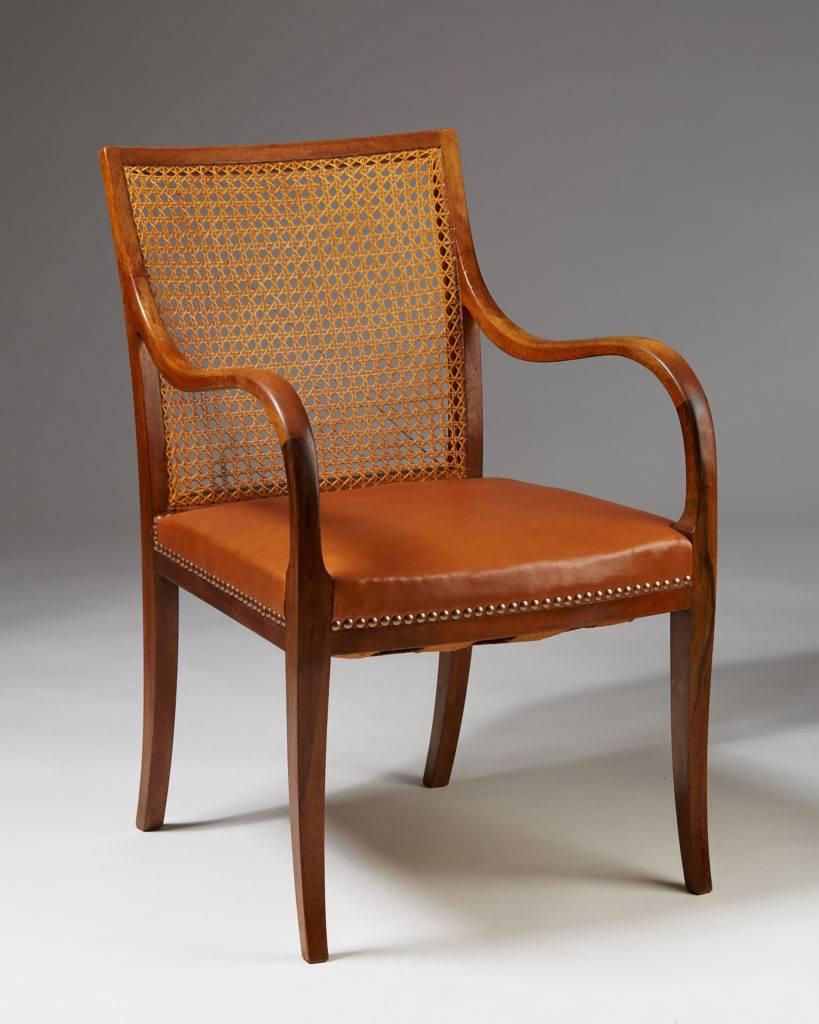 Chair designed by Frits Henningsen, 
Denmark, 1940s.

Walnut and cane.

Measures: H 86 cm/ 2' 10 3/8